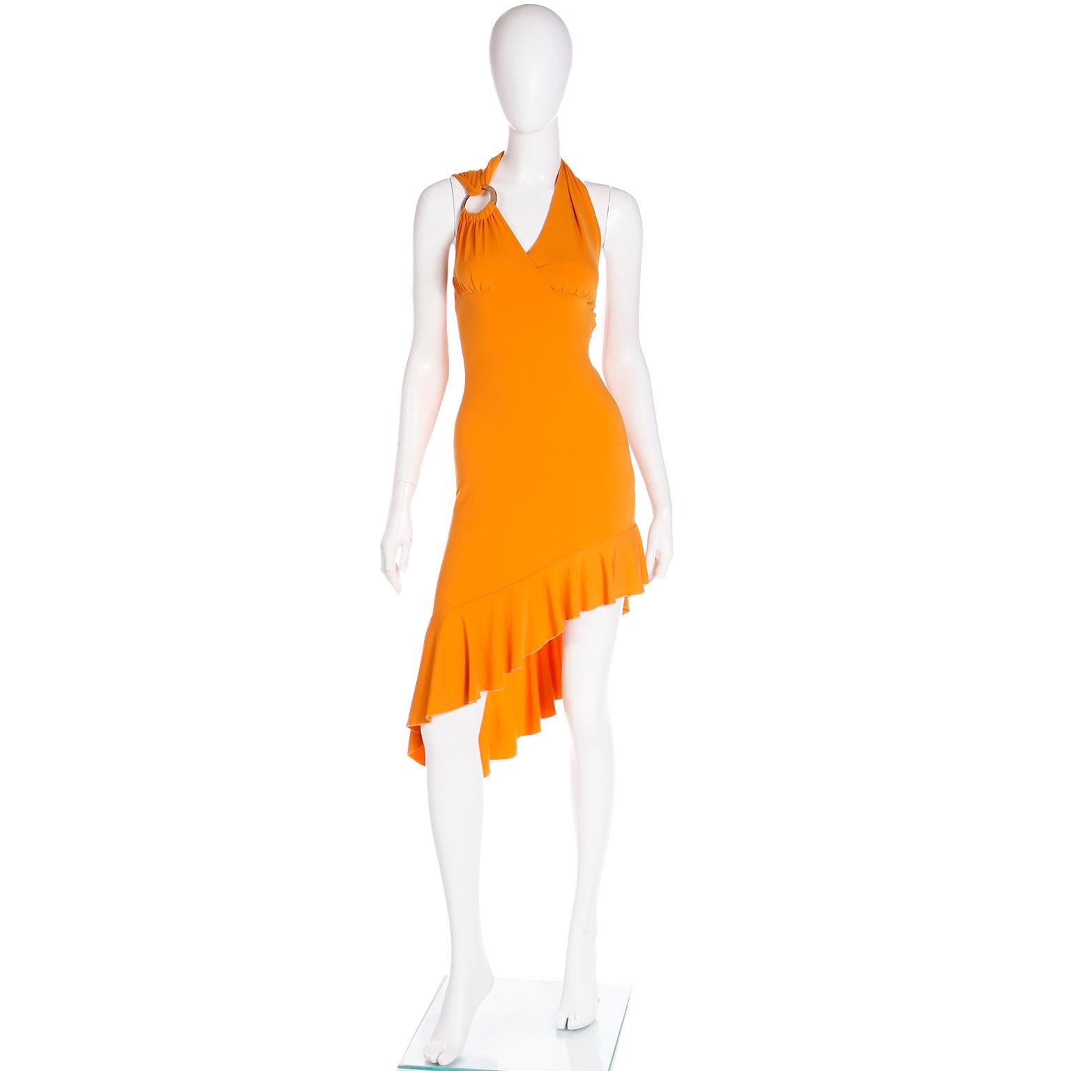We think this incredible vintage Gianni Versace orange dress is such a great example of Y2k fashion done right! This Versace dress is deadstock with its original tag attached and it has so much effortless style!
This tangerine orange jersey dress