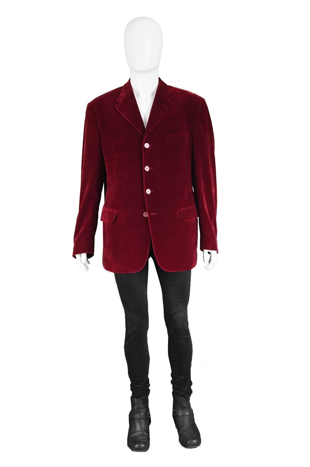 Gianni Versace Versus Men's Dark Red Velvet Vintage Blazer Jacket, 1990s

Size: Marked 54 which is roughly a men's Large to XL. Please check measurements. 
Chest - 44” / 112cm
Waist - 42” / 106cm
Length (Shoulder to Hem) - 30” / 76cm
Shoulder to