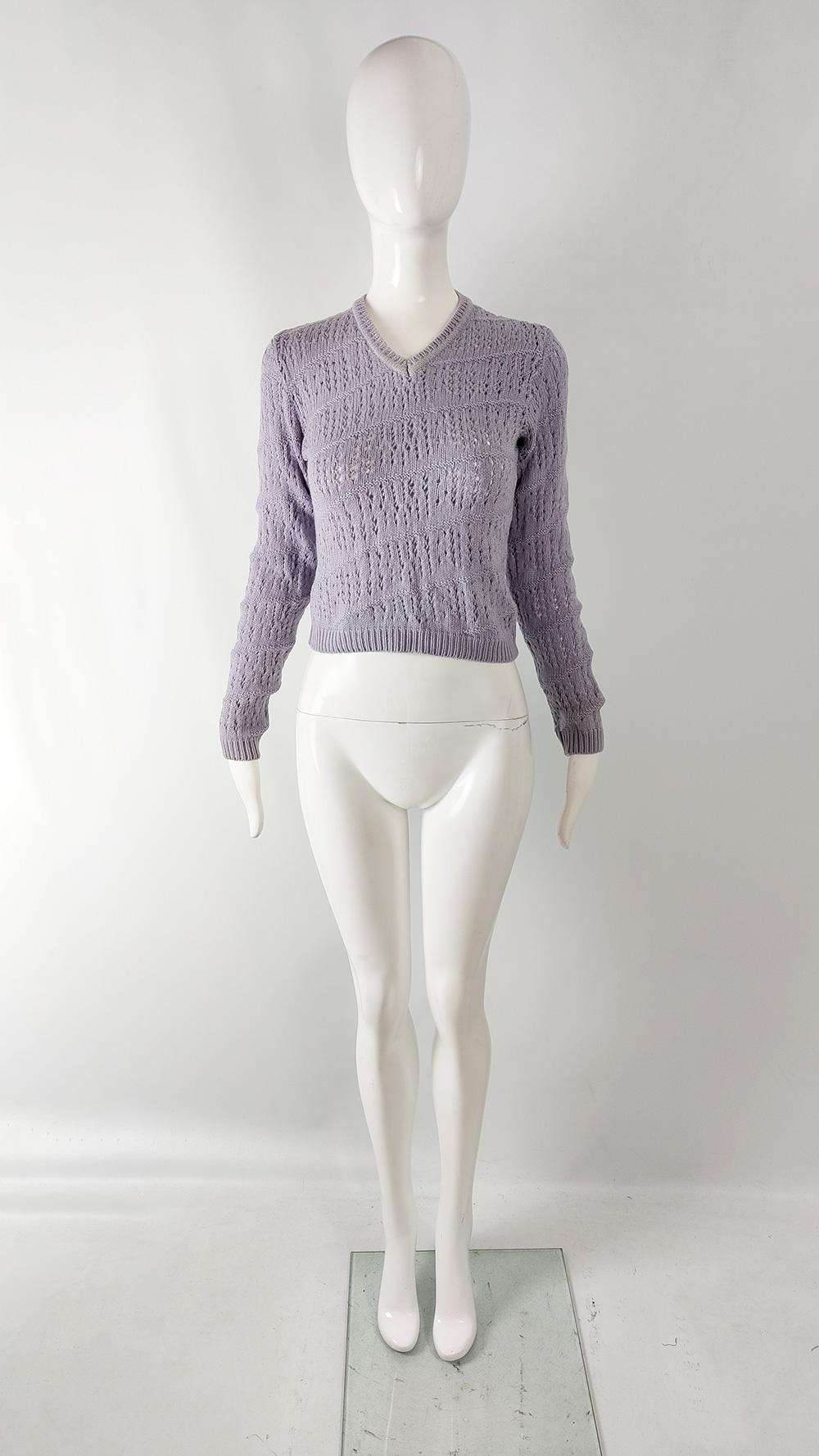  cute vintage womens sweater from the 90s by luxury Italian fashion designer, Gianni Versace for the Versus line. Made in Italy, from a lavender / pastel purple virgin wool fabric with incredible pointelle knit designs including a twisted design