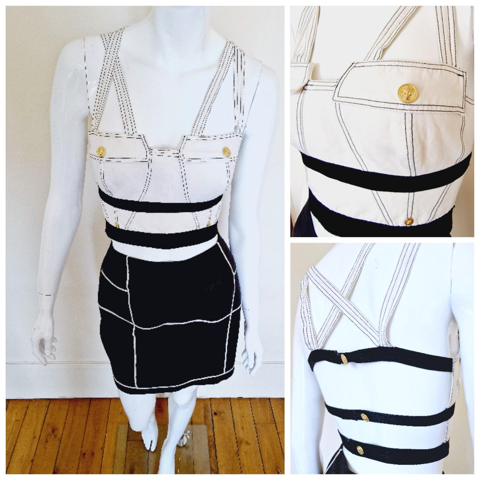 Gianni Versace BONDAGE 2-piece dress from the 90s!
Bustier + skirt!
Gianni`s Versus line.
Iconic look!
Lion Versace buttons and snaps!
A pocket on the skirt.

VERY GOOD condition!

SIZE
It fits for: bigger medium to smaller large. On the top you can
