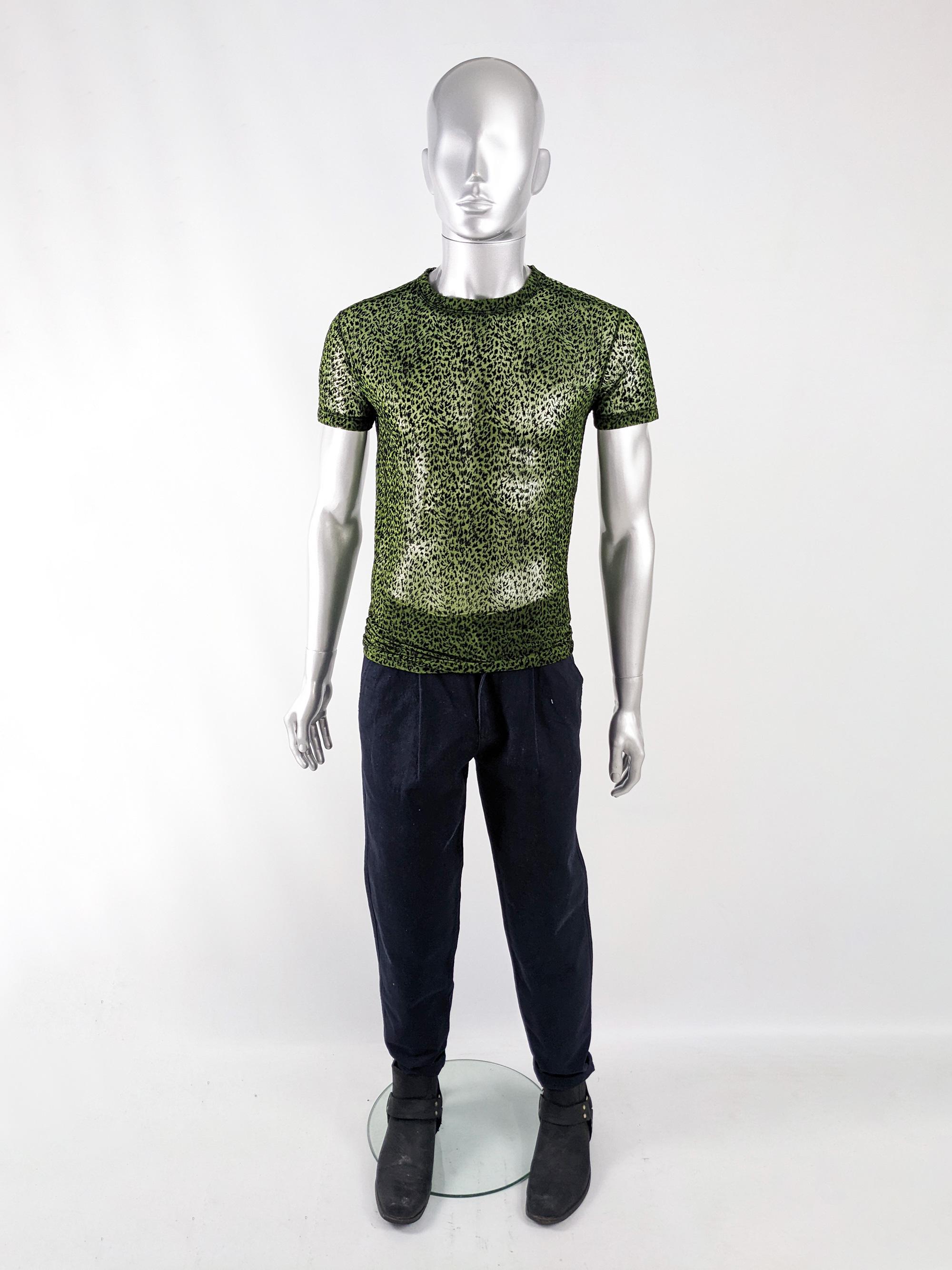 An incredible and rare vintage mens short sleeve top from the late 90s by luxury Italian fashion designer, Gianni Versace for the Versus Versace line. In a green sheer mesh with black flocking throuhgout creating an animal print.

Size: Marked