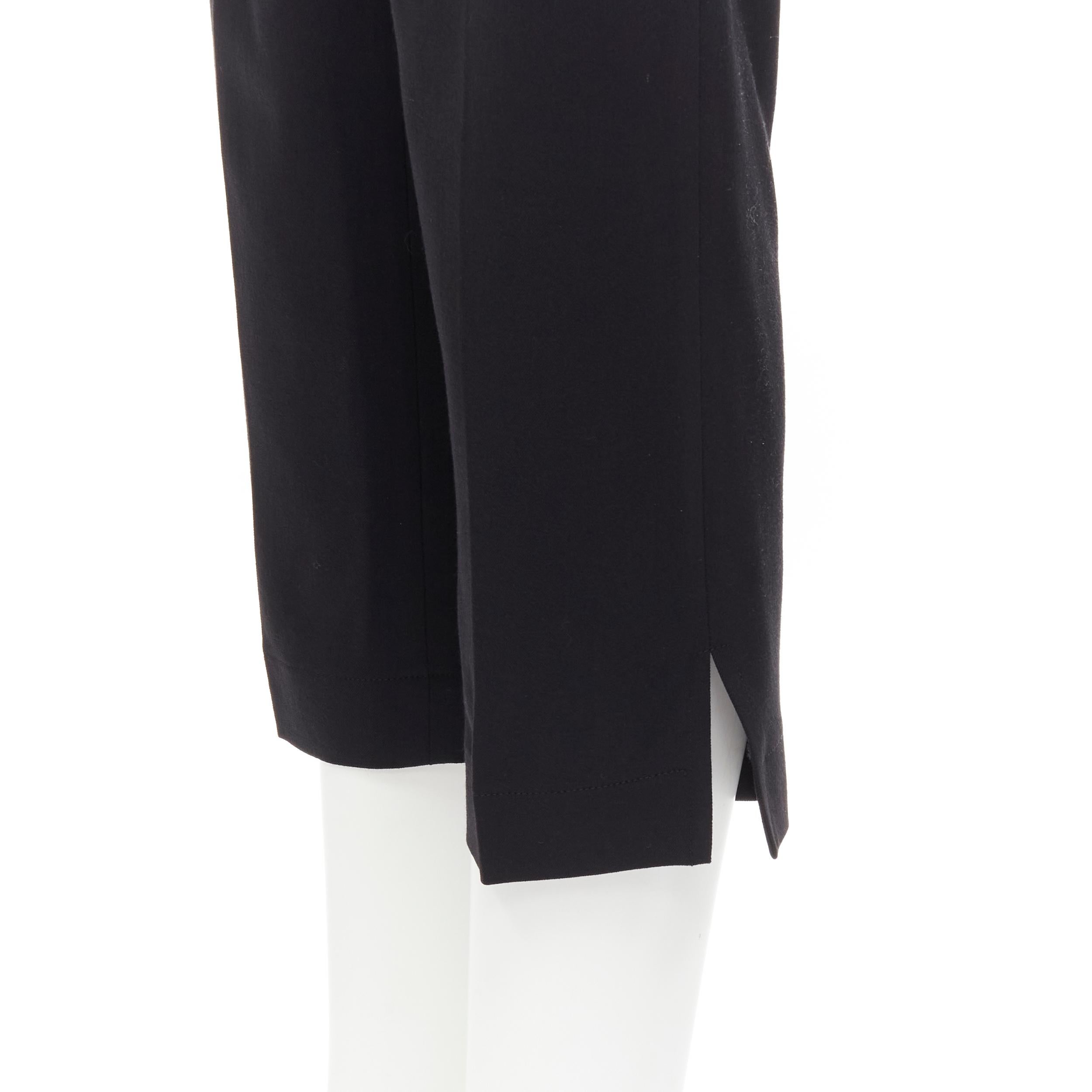 GIANNI VERSACE Vintage black viscose wool high waisted slit trousers IT38 XS 
Reference: LNKO/A01969 
Brand: Gianni Versace 
Material: Viscose
Color: Black 
Pattern: Solid 
Closure: Zip 
Extra Detail: High waisted. Dual front pockets. 
Made in: