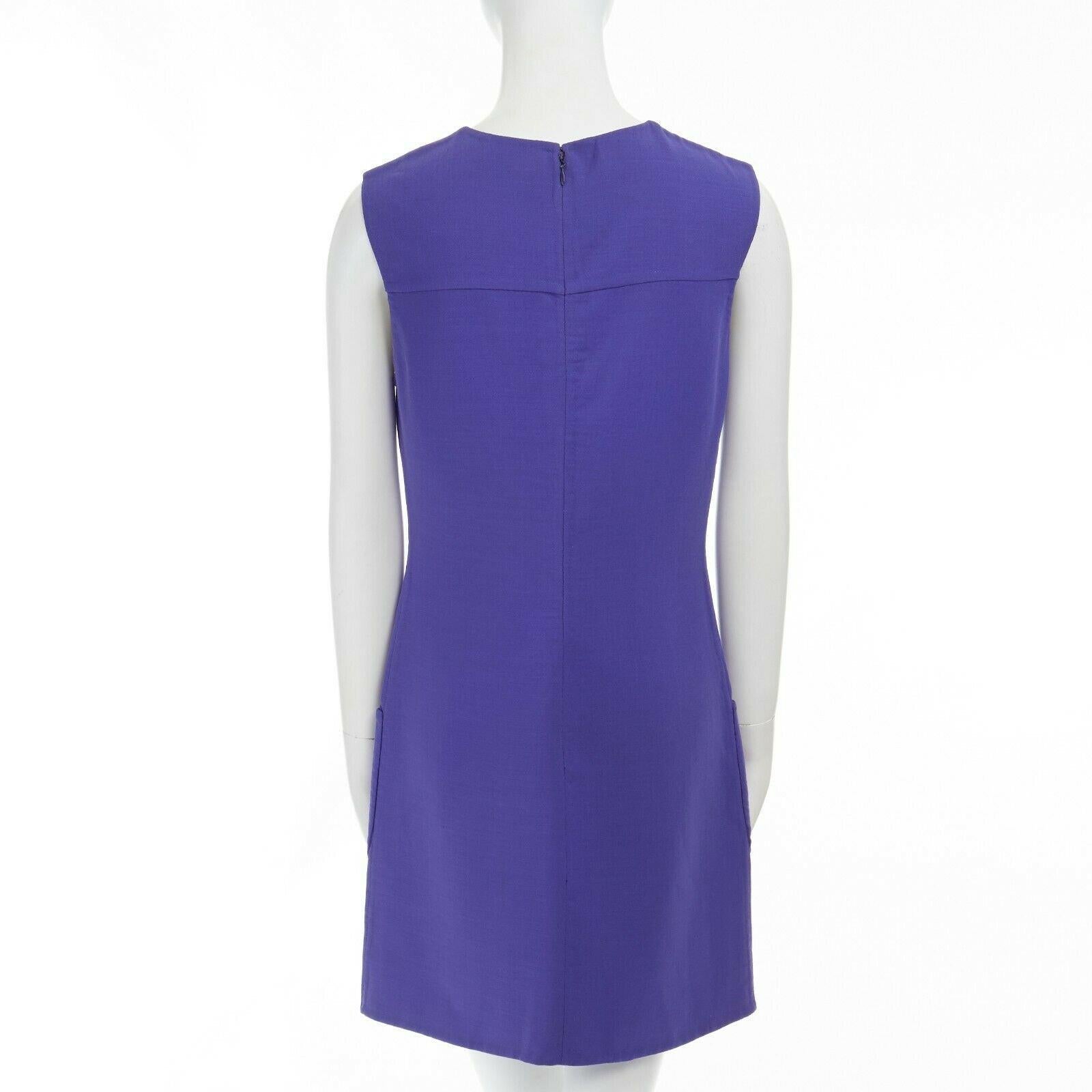 GIANNI VERSACE Vintage blue patch pocket sleeveless shift cocktail dress M Reference: TGAS/A02940 
Brand: Versace 
Designer: Donatella Versace 
Color: Blue 
Pattern: Solid 
Closure: Zip 
Extra Detail: Muted cobalt blue. Mid weight fabric. Round