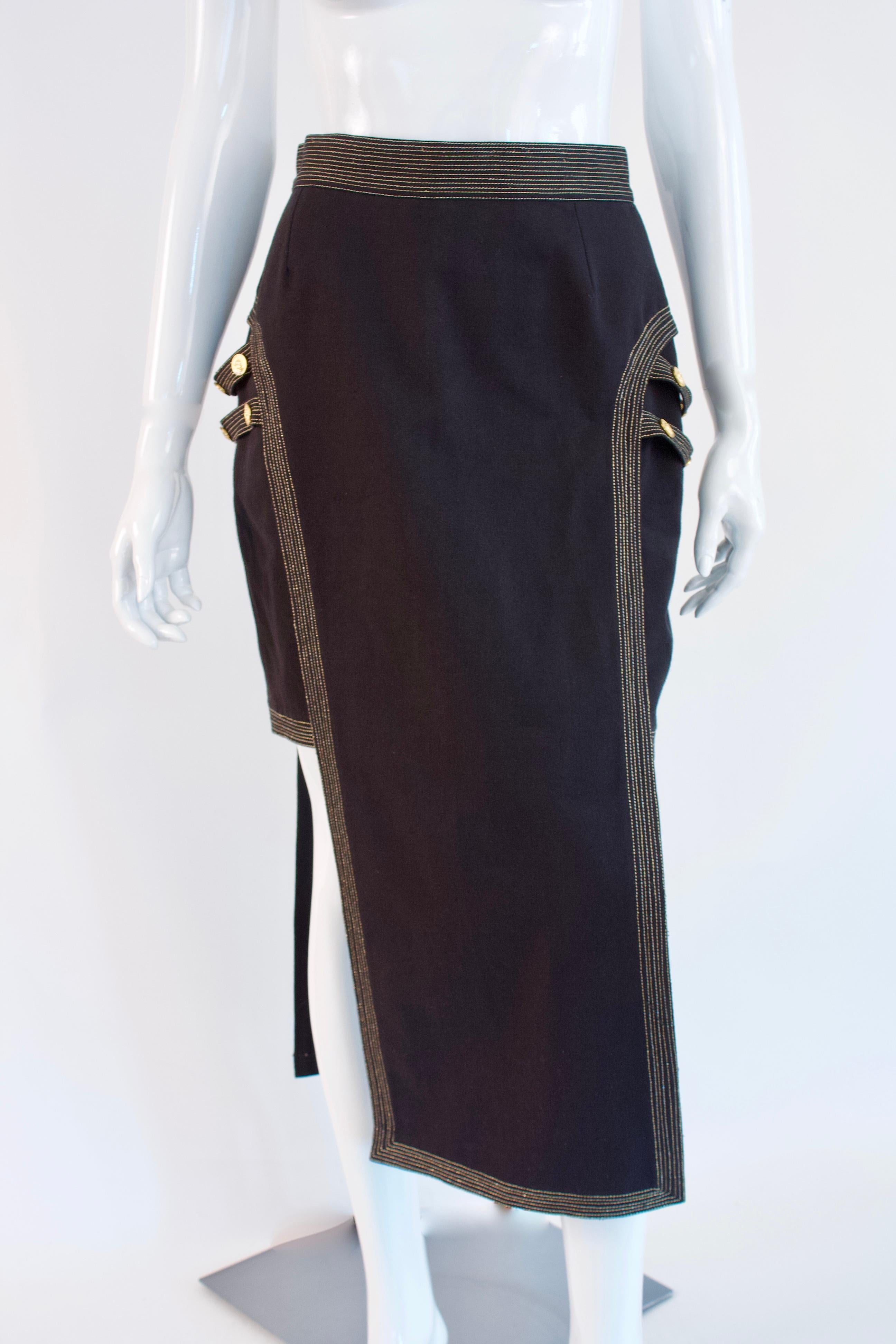 Rare Vintage GIANNI VERSACE Short Long Bondage Skirt.  This incredible Versace skirt features gold lion head buttons and bondage accents.  It's love.

 Designer: Gianni Versace Versus

Condition: Excellent

Size: fits like a small-medium,