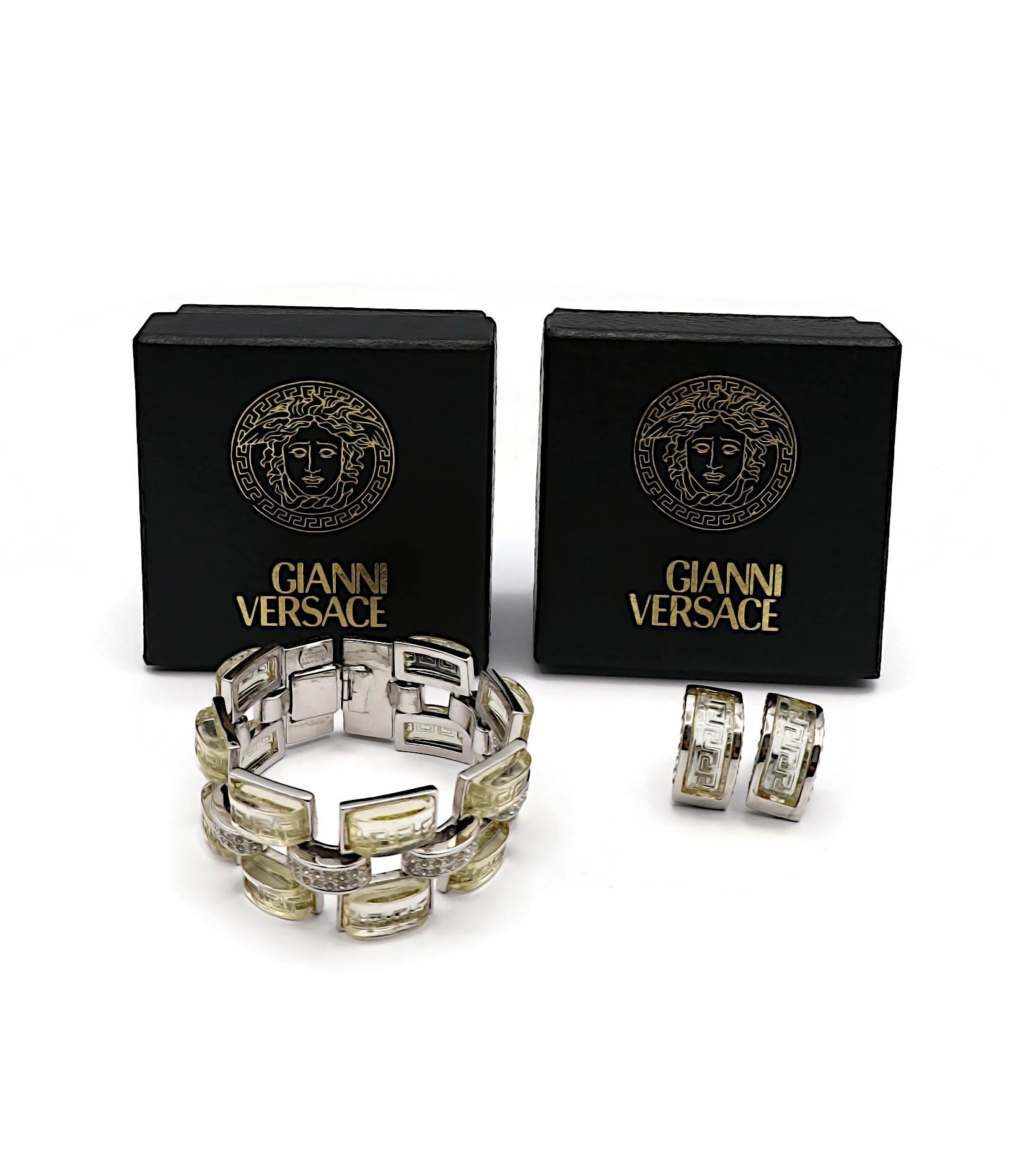 GIANNI VERSACE vintage silver tone bracelet and matching half hoop earrings (clip-on) embellished with pale yellow resin elements embossed with greek friezes, clear crystals.

Embossed GIANNI VERSACE Made in Italy (only on the bracelet / the