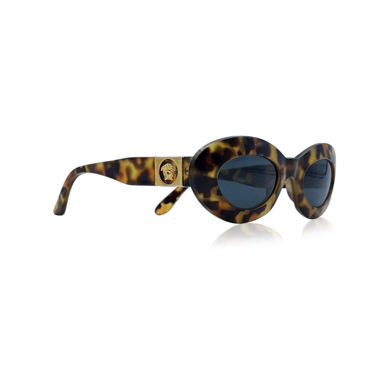 Brown oval shaped vintage sunglasses Mod. 415/C Col. 279 by Gianni Versace. Iconic 90s sunglasses with double gold metal Medusa detailing on temples. Made in Italy. Original 100% Total UVA UVB protection original grey lenses



Details

MATERIAL: