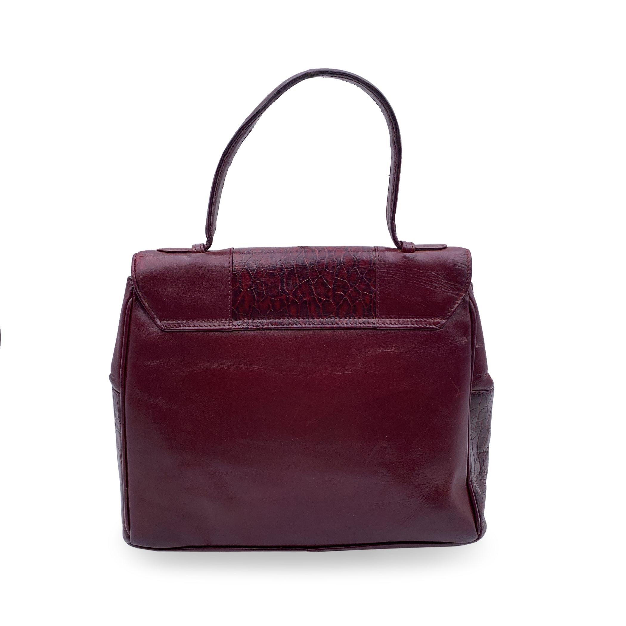 Gianni Versace Vintage Burgundy Embossed Leather Handbag Satchel In Good Condition For Sale In Rome, Rome