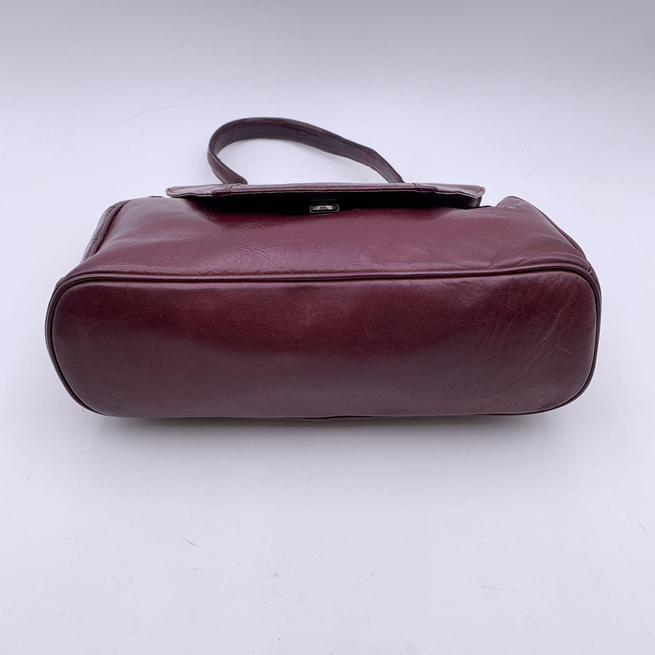 Women's Gianni Versace Vintage Burgundy Embossed Leather Handbag Satchel For Sale