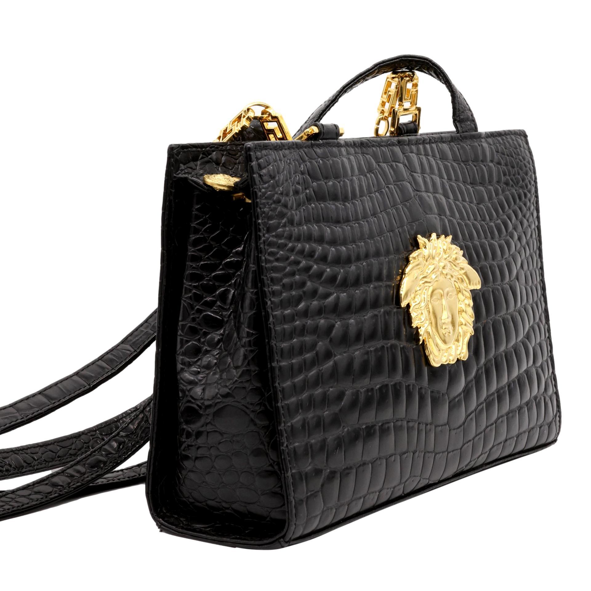Gianni Versace Vintage Embossed Crocodile Medusa Shoulder Crossbody Bag, 1992 - 1993. Established in 1978, Gianni Versace became well known world wide for his use of bold colors and bright prints inspired and designed around ancient Greek mythology.