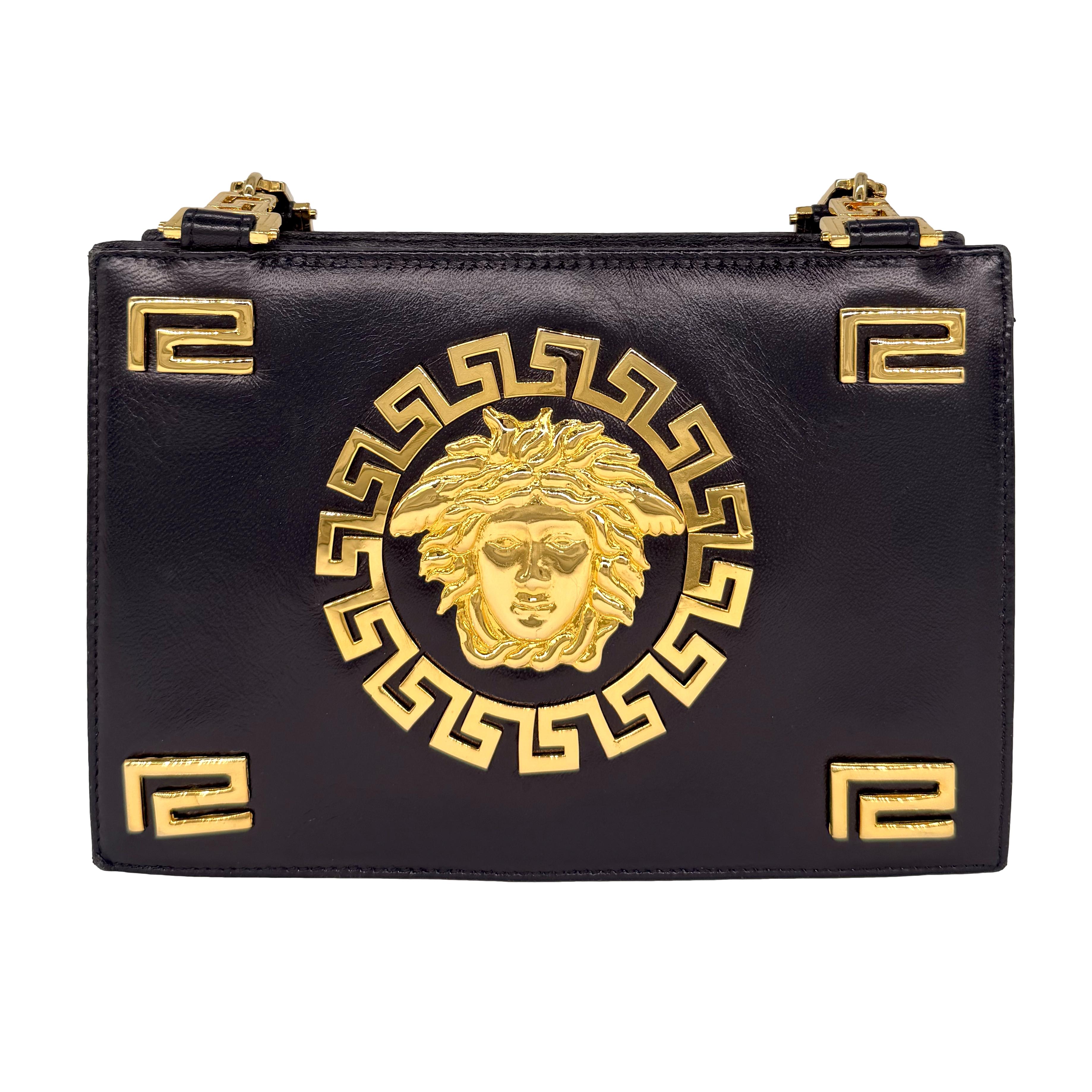 Gianni Versace Vintage Medusa Gold & Leather Shoulder Crossbody Bag, F/W 1992. Established in 1978, Gianni Versace became well known world wide for his use of bold colors and bright prints inspired and designed around ancient Greek mythology. This