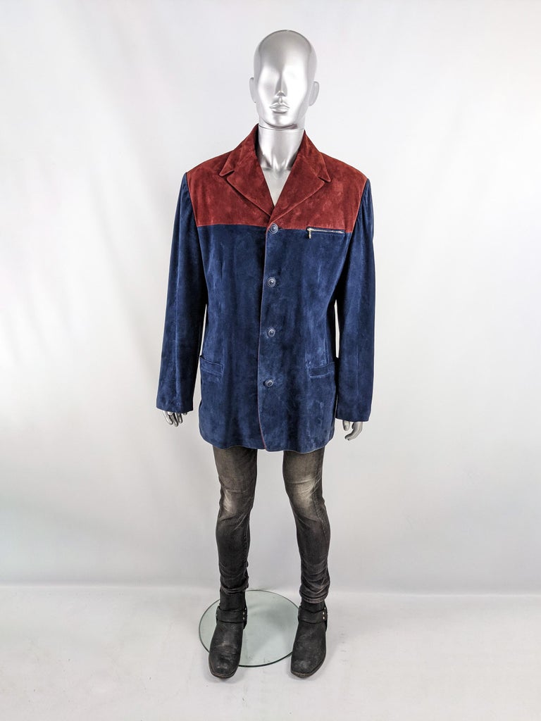 An incredible vintage mens Gianni Versace jacket from the Autumn Winter 1997 collection (designed by Gianni himself). In a blue and red color blocked suede with four Medusa head buttons down the front, a cool zip design on the left chest and peaked
