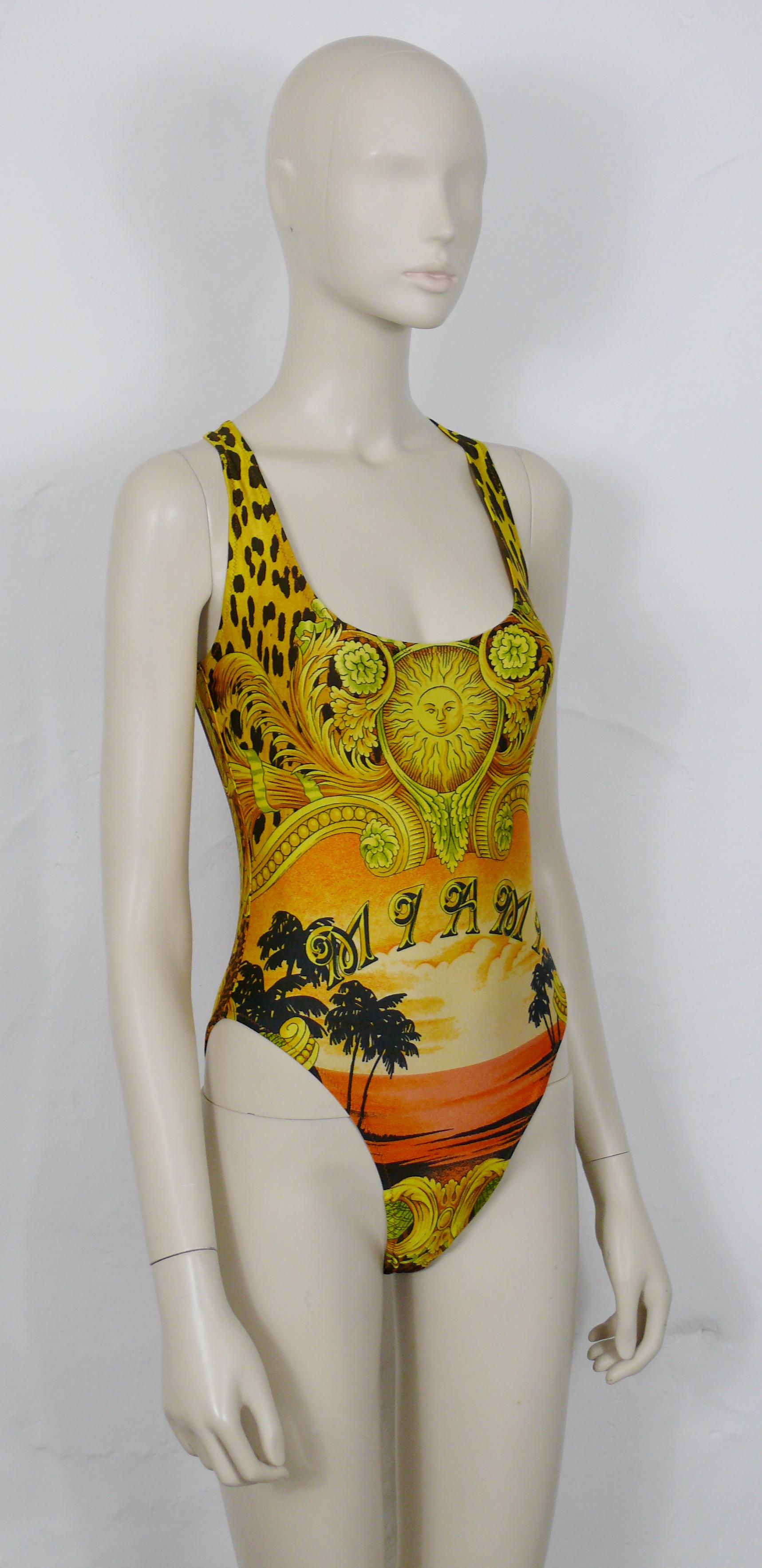 GIANNI VERSACE vintage one-piece backless swimsuit featuring a GIANNI VERSACE signature Barroco print with MIAMI beach sunset palm trees.

Label reads VERSACE MARE Made in Italy.

Size tag reads : 44 (on front) and II (on reverse).
Please refer to