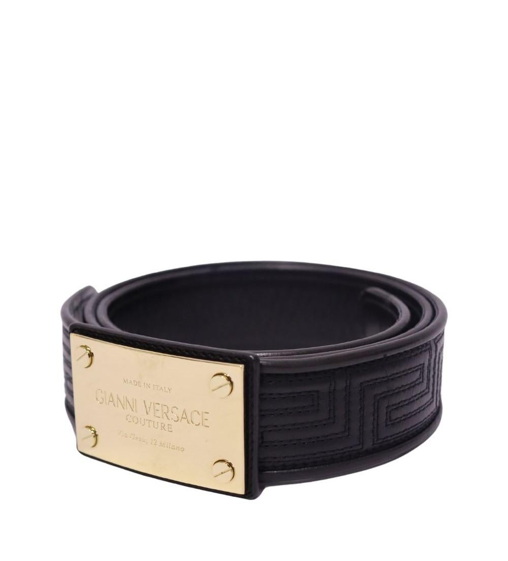 Gianni Versace Women's Quilted Leather Logo Plaque Buckle Belt, Features a logo plaque buckle and signature Greca pattern.

Material: Leather
Width: 40mm
Hardware Color: Gold
Size: 85cm
Overall condition: Good
