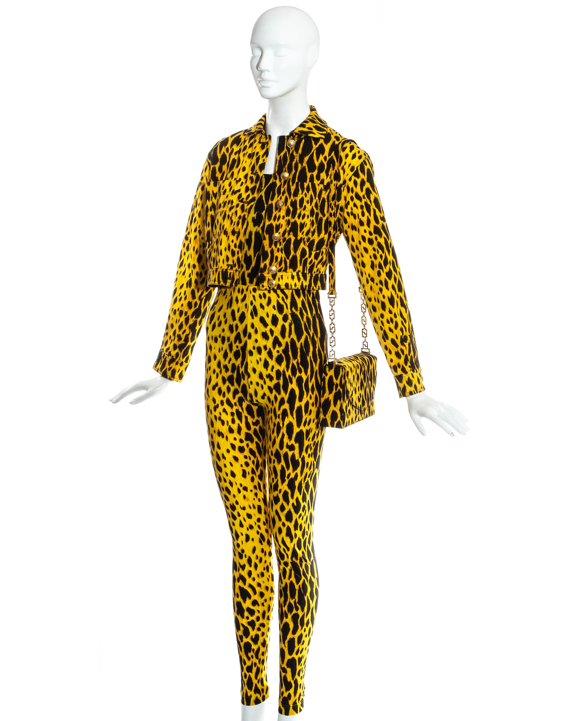 Gianni Versace yellow and black leopard print ensemble, includes lycra bodysuit and leggings, denim jacket and matching flap bag with gold chain. 

Spring-Summer 1992