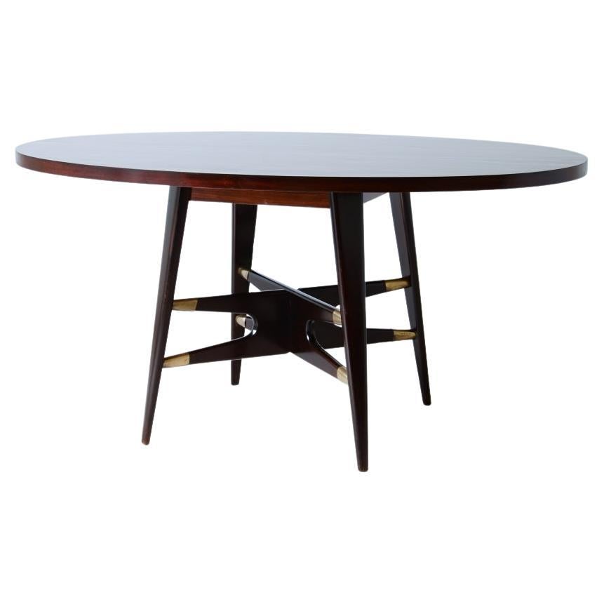 Gianni Vigorelli, elegant oval table in stained wood 