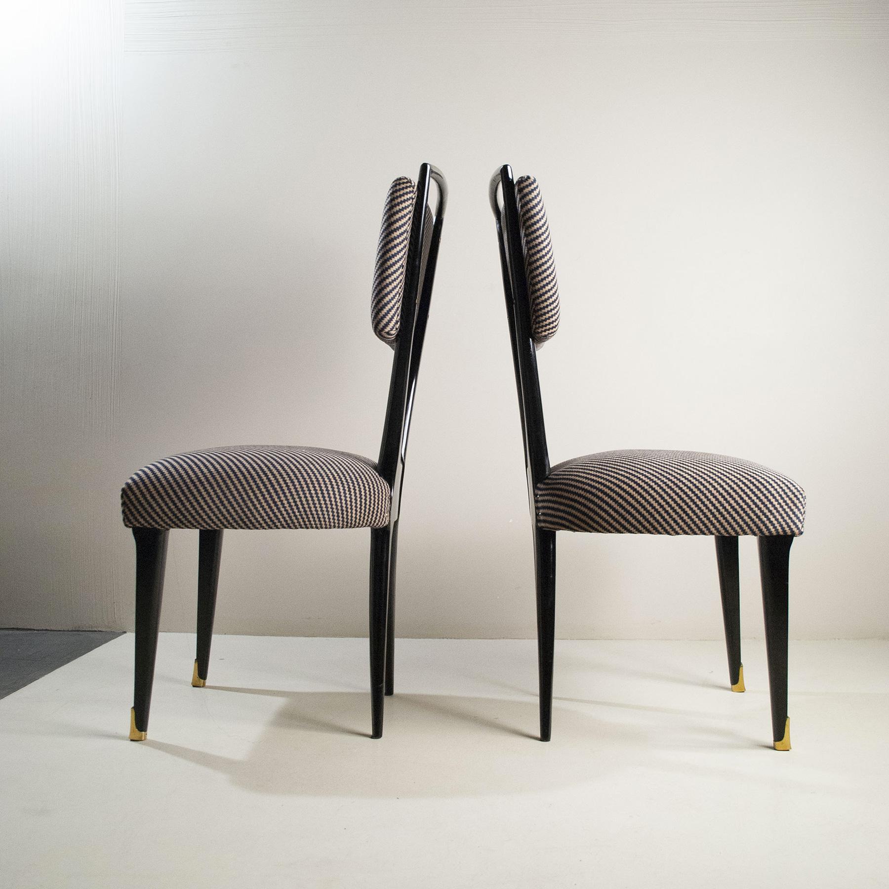 Set of eight chairs in dark walnut wood, original period fabric, brass ferrules, 1950s production by Gianni Vigorelli.