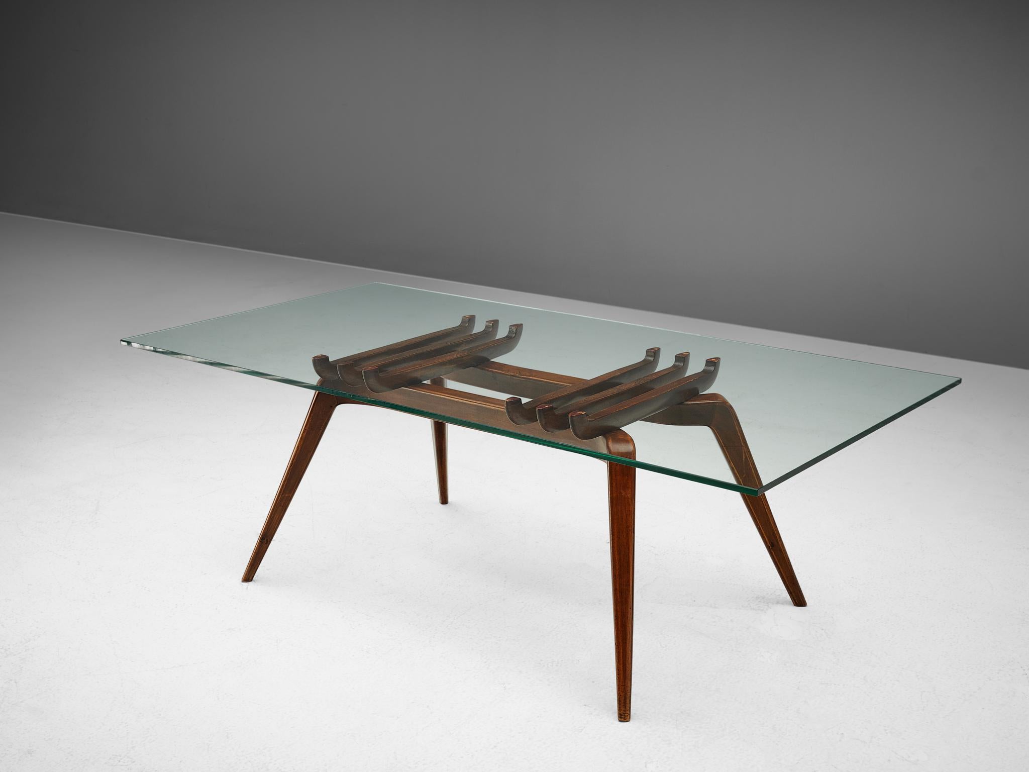 Gianni Vigorelli, coffee table, walnut, glass, Italy, 1950s

This sculptural table is designed by Italian designer Gianni Vigorelli. On a base made out of beautiful walnut wood lays the rectangular glass top. Four tapered and slanted legs are