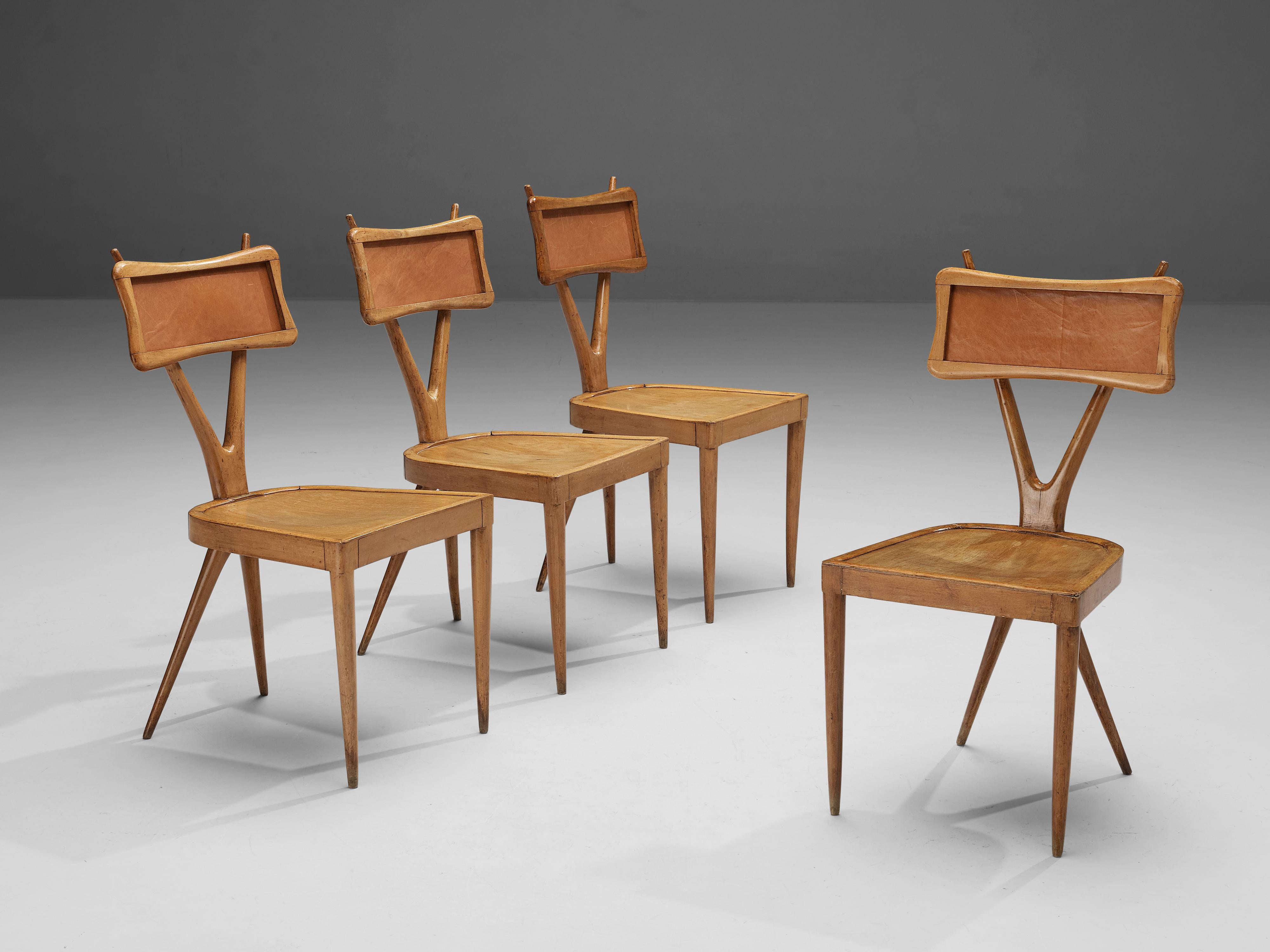 Gianni Vigorelli, set of four dining chairs, beech, plywood, fabric, Italy, 1950s.

These chairs are beautifully constructed featuring a X-shaped frame, a striking detail that convinces visually. The backrest is carved in a subtle manner and