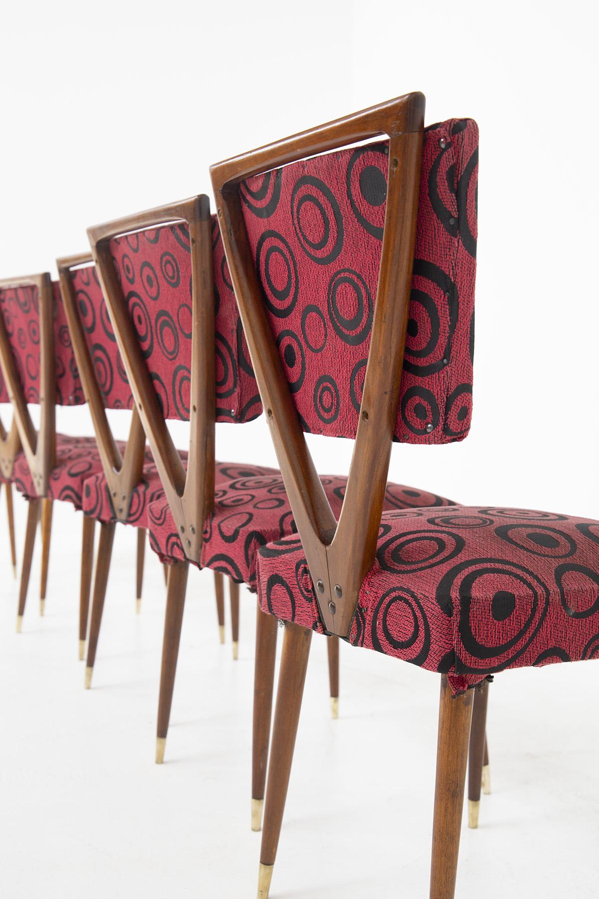 The set of six extravagant dining room chairs are design by Gianni Vigorelli in the ‘50s and are of fine Italian manufacture. 
The peculiar chairs have their original red fabric with a fun pattern of dark circles. The wooden structure is