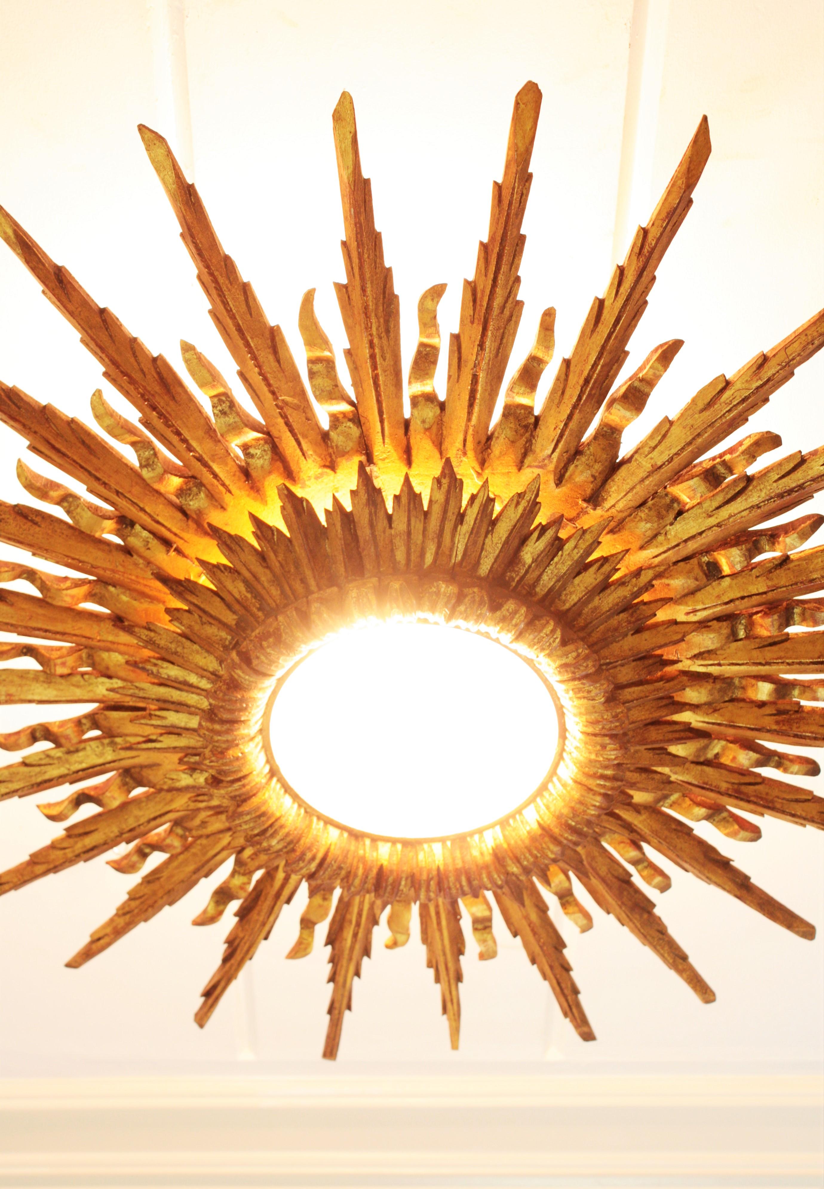 Carved Giant 1930s Baroque Gold Leaf Giltwood Sunburst Ceiling Light Fixture or Mirror