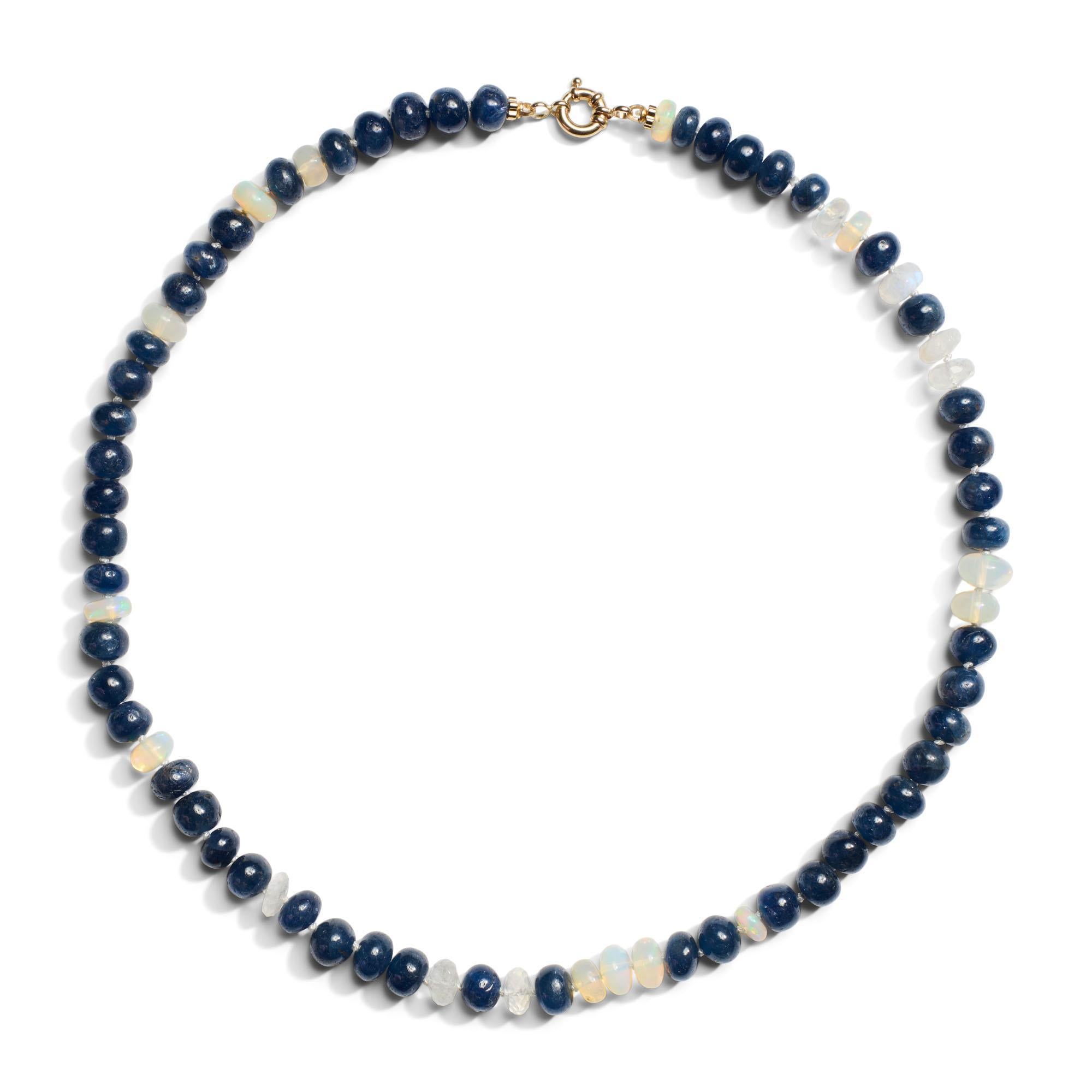 Add a mesmerizing touch to any outfit with this deep blue beaded necklace with Welo Opals in 14K yellow gold. This stunning necklace is made with shimmering Ethiopian Opals that give this necklace a regal apperance. Furthermore rainbow moonstones