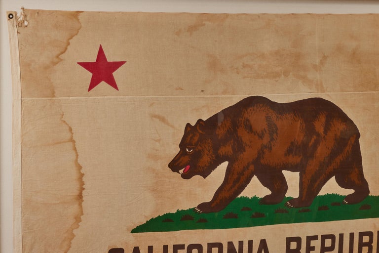 Early California state bear flag. Super graphic and bold colors. Perfect amount of patina and wear as expected for a flag of this vintage. Earlier design. Note the seam just under the single red star.