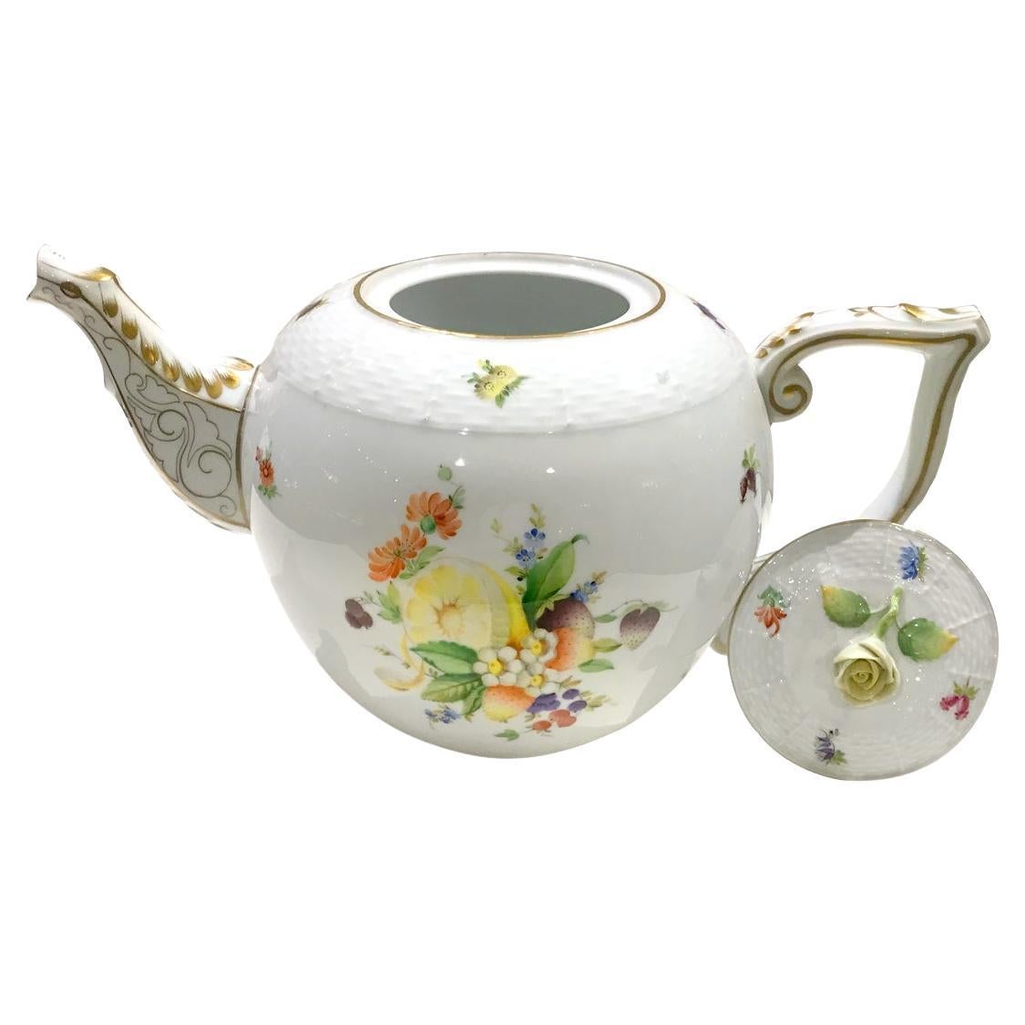 Lovely XXL size Herend Porcelain Teapot. CFR model, decorated with fruits such as lemons, strawberries, and flowers hand-painted. The teapot has a wickerwork texture finish on the lid, known as the 