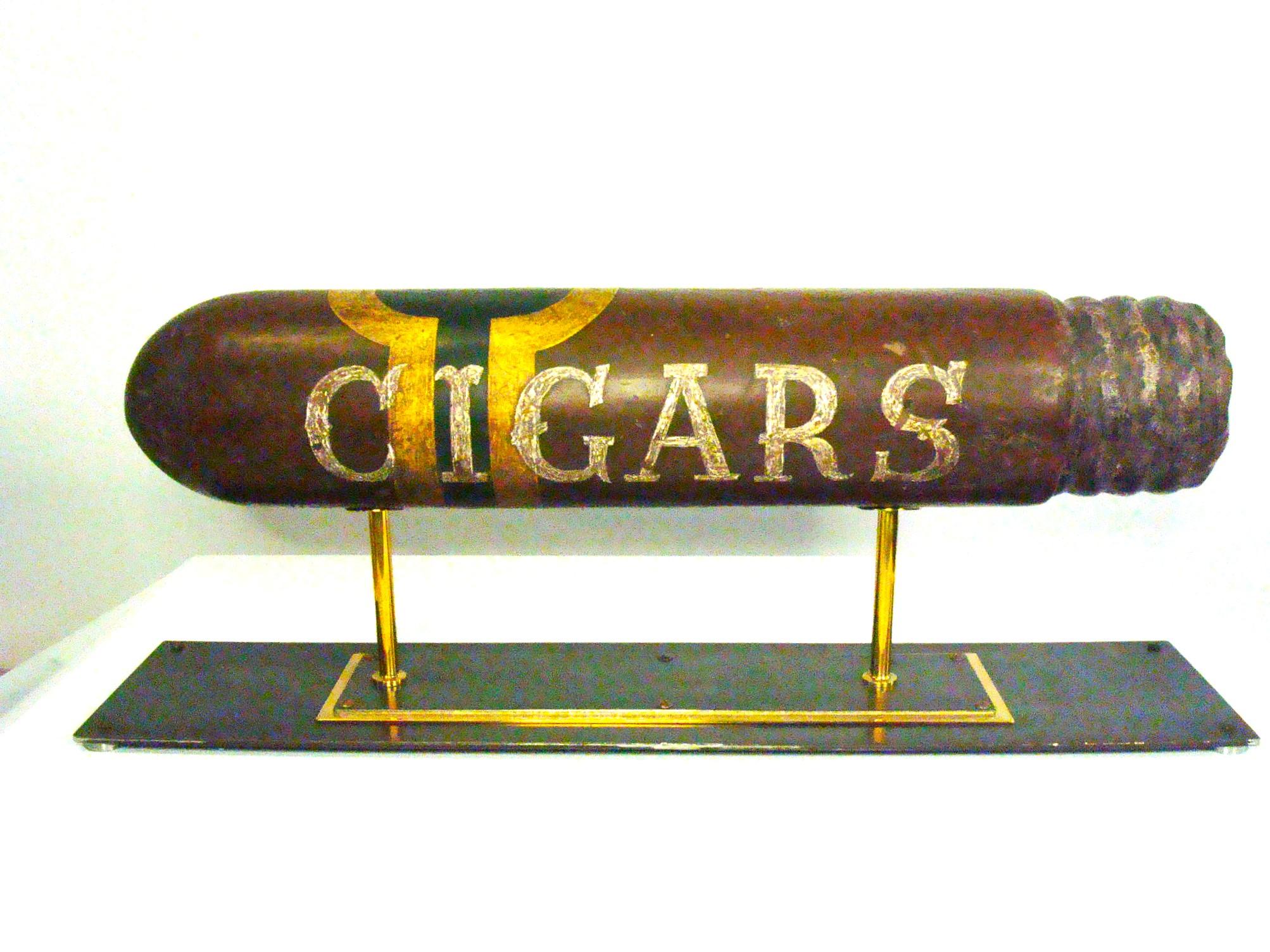 Giant Advertising Cigar Statue / Bar Lounge / Cigars.
Large Cigar Tobacco Trade Sign Cigars, made of wood with an iron and brass support. Fantastic Folk Art Sculpture.
This is a Giant / Big  Cigar Advertising Sign Counters top sign.
This sign would