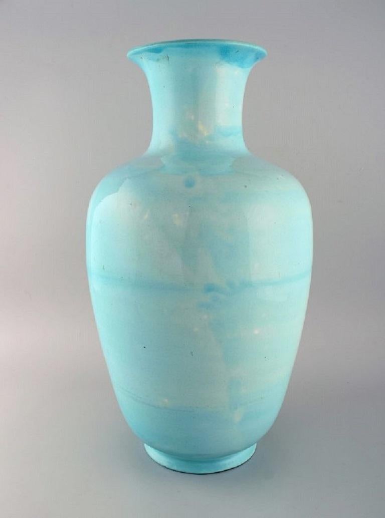 Giant antique Zsolnay floor vase in glazed ceramics. Beautiful glaze in turquoise shades. 
Dated 1891-1895.
Measures: 50 x 27 cm.
In excellent condition. Small crack in the glaze from the production.
Stamped.