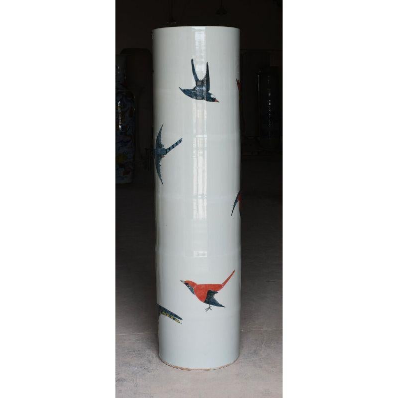 Giant vase, birds by WL Cermics
Design: Norman Trapman
Materials: Porcelain
Dimensions: H175 x Ø48 cm 

This series finds its origin in a fascination for the history of ceramics. A vast collection of vases in innumerable shapes and decorations