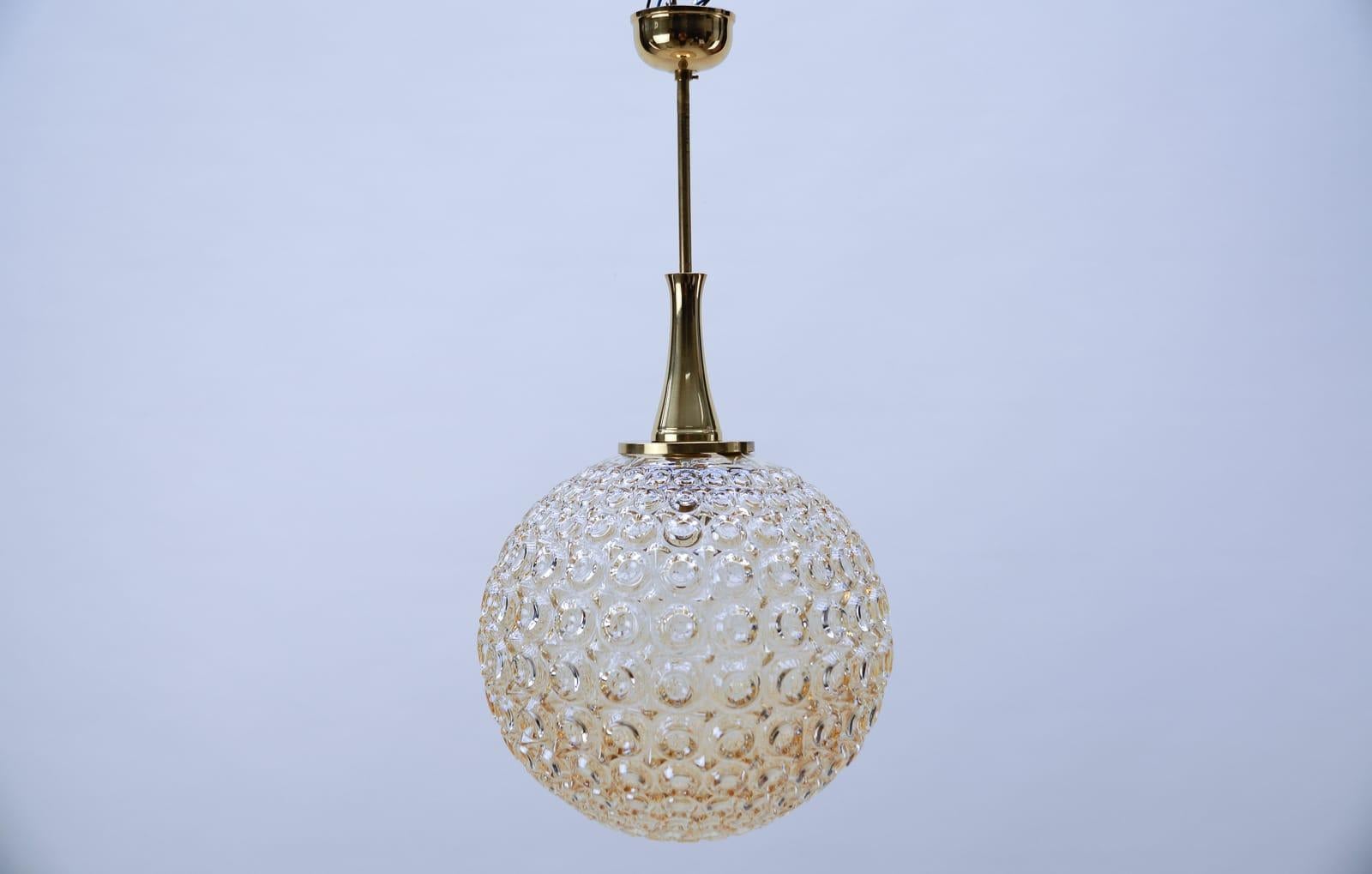 Giant bubble glass amber pendant lamp, 1960s

Fully functional.

With an E27 socket. Works with 220V and 110V.

Wiring is suitable for all countries.