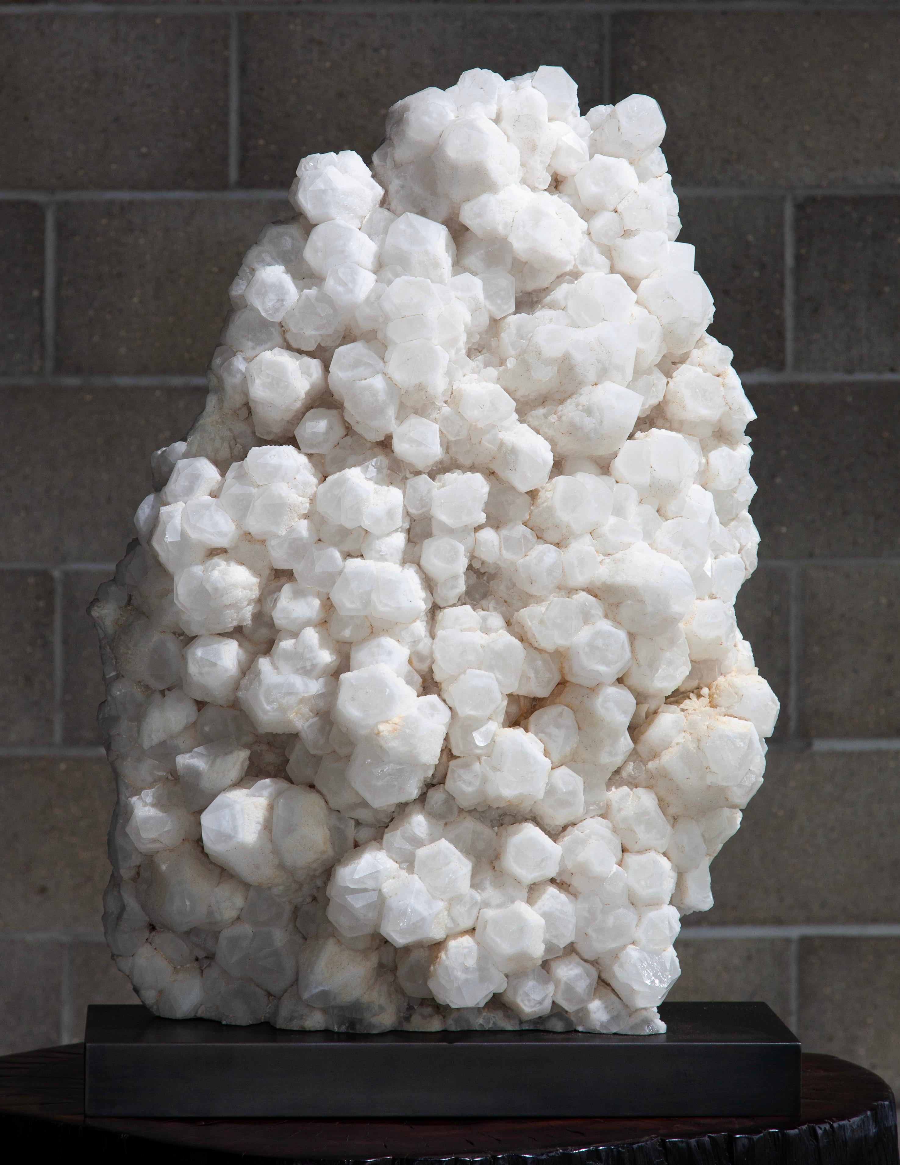 Candle Quartz from Madagascar is a captivating variety of quartz known for its unique, elongated, and columnar crystal formations that resemble candles. These crystals typically develop with a central shaft and radiating growths, giving them a
