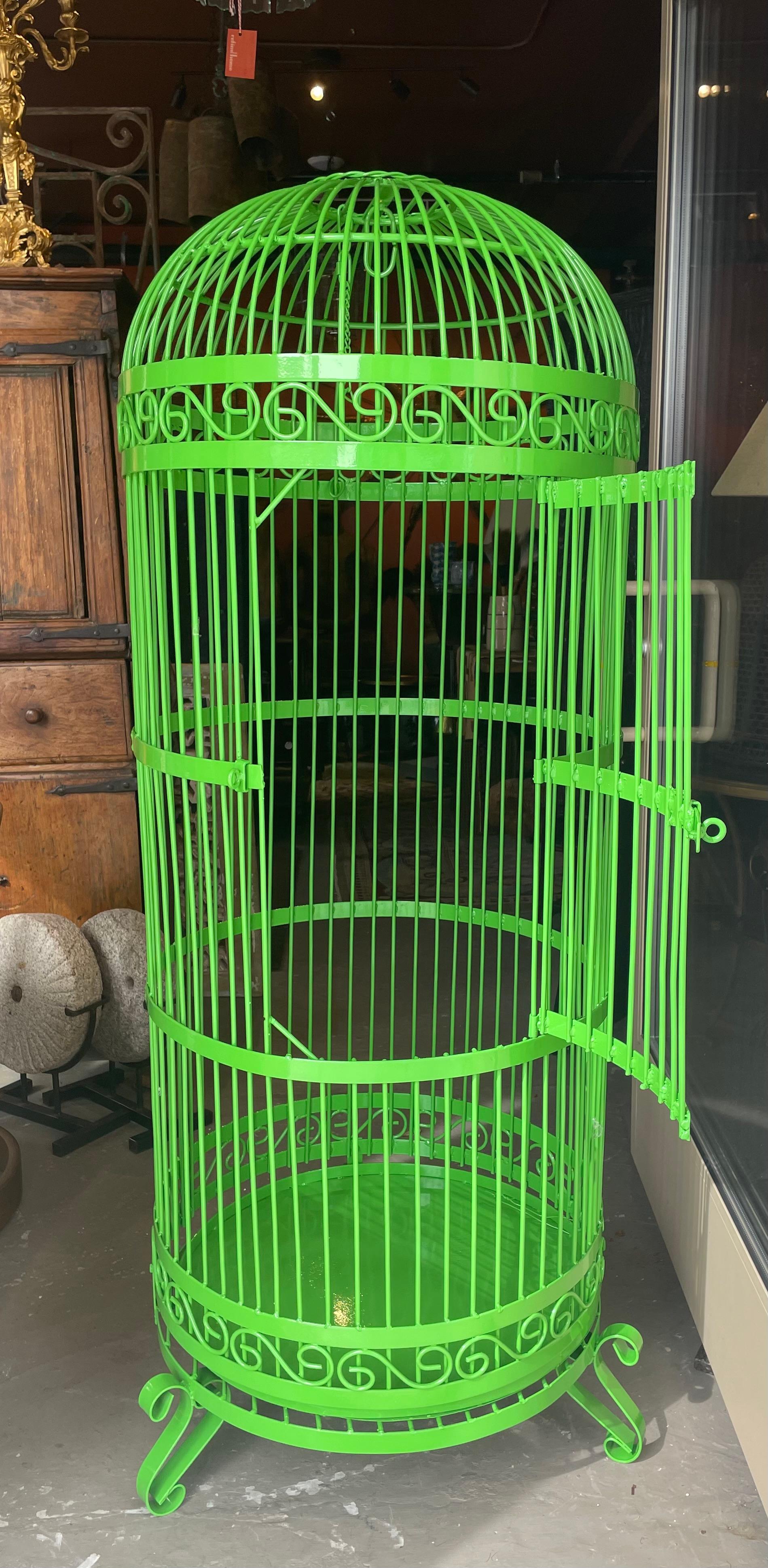 This wonderful birdcage has so many potential uses. It is meant to stand on the floor but can also be suspended from the ceiling. Gorgeous green surface will enhance any room. The cage itself is 24