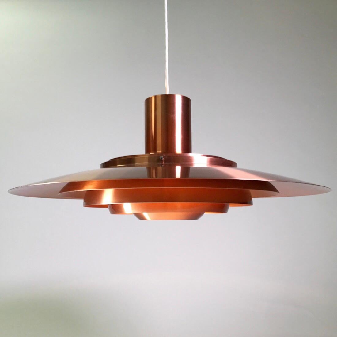 Majestic floating from the ceiling does this elegant and rare P700 copper ceiling light by Jørgen Kastholm and Preben Fabricius for Nordisk Solar Compagni, Denmark 1964.

Finding a P700 copper version in this condition, even here in Denmark, where