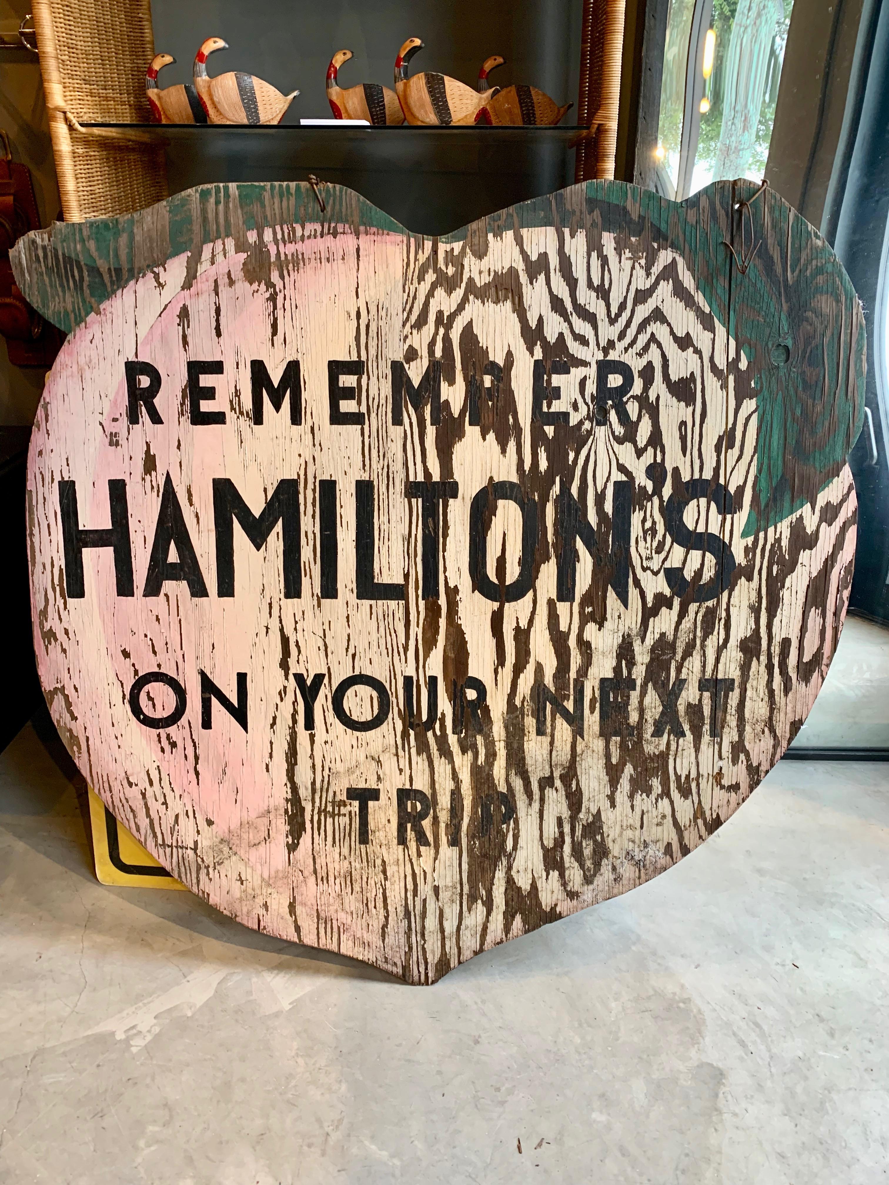 Great wooden trade sign from a California farm. Giant peach with graphics on both sides. Sign reads 'Hamilton's Tree Ripened Peaches 1/2 Mile' on one side, and 'Remember Hamiltons On Your Next Trip' on the other. Awesome coloring, wear, graphics and