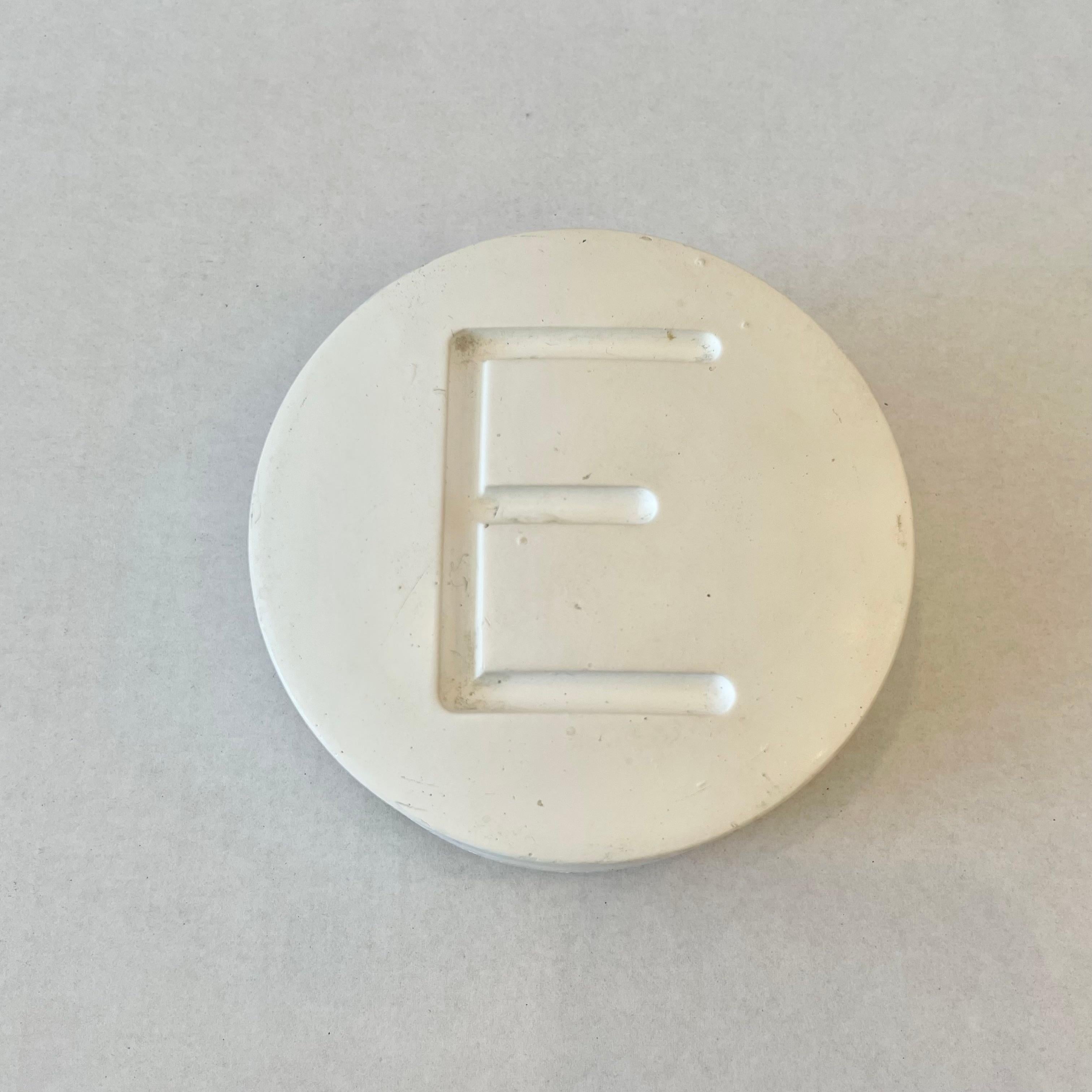 white pill with letter e