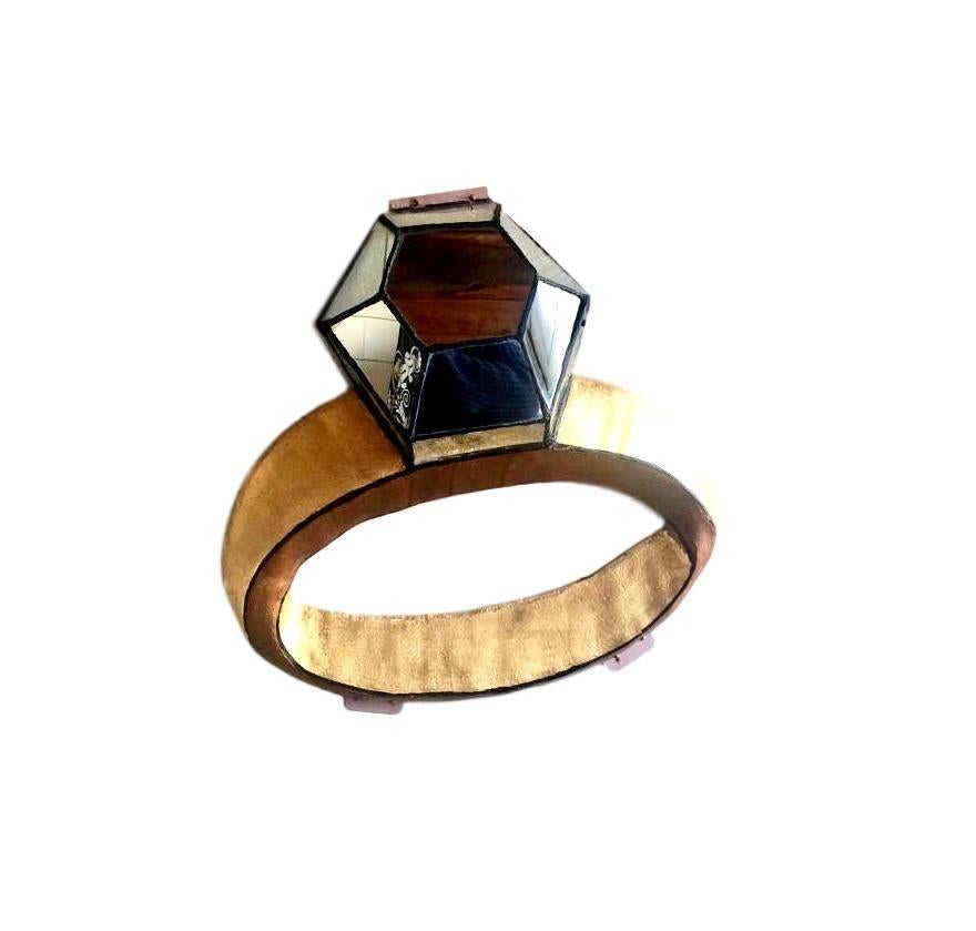 Massive diamond ring made of fiberglass and mirror. Entire frame is made of fiberglass and hand-painted. Diamond has overlaid mirror to resemble a diamond. Great piece of pop art. Measures: 25