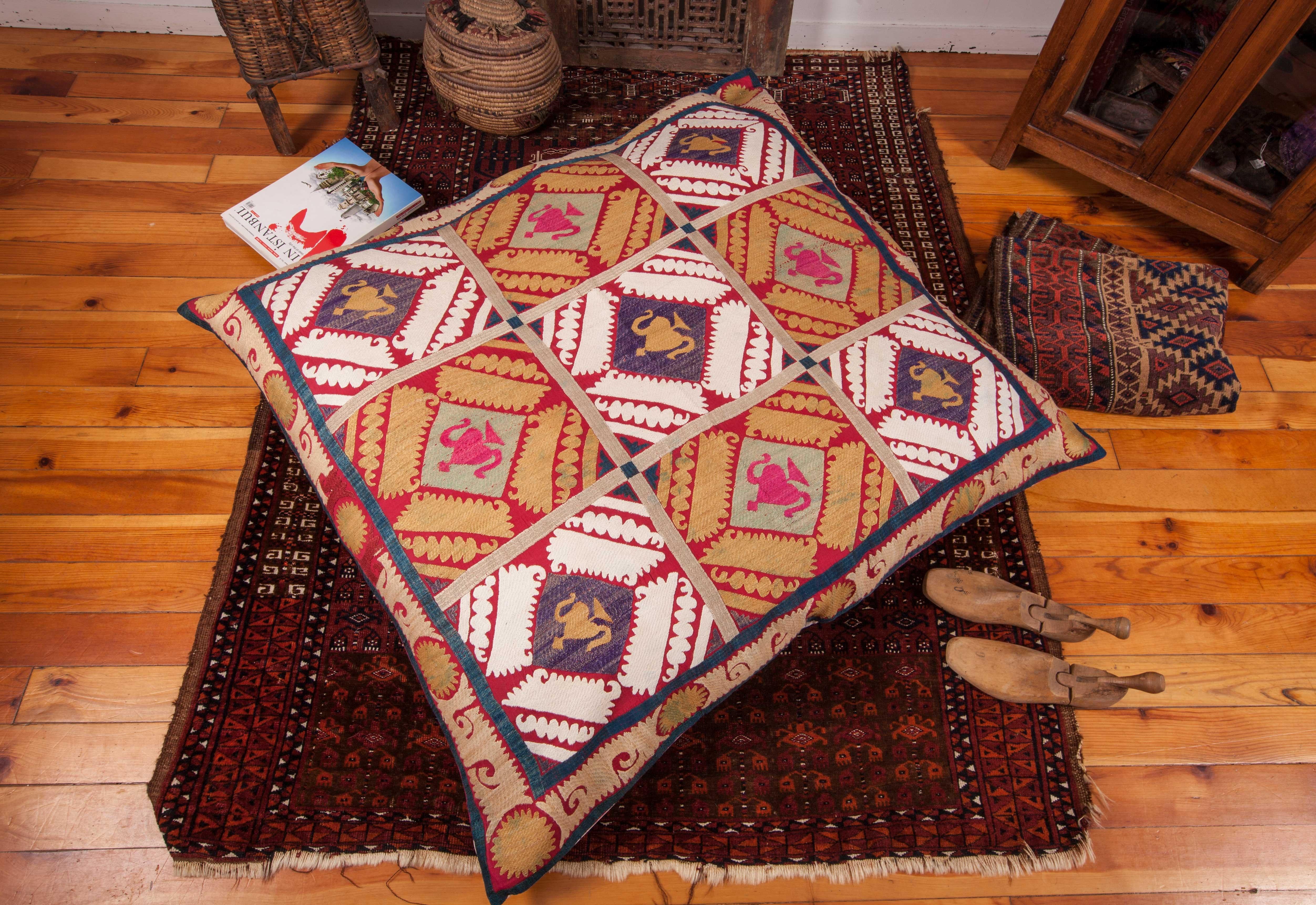 The pillow is made from a mid-20th century, Uzbek Samarkand Suzani. It does not come with an insert but it comes with a bag made to the size and out of cotton to accommodate the filling materials. The backing is made of pure linen. Please note: