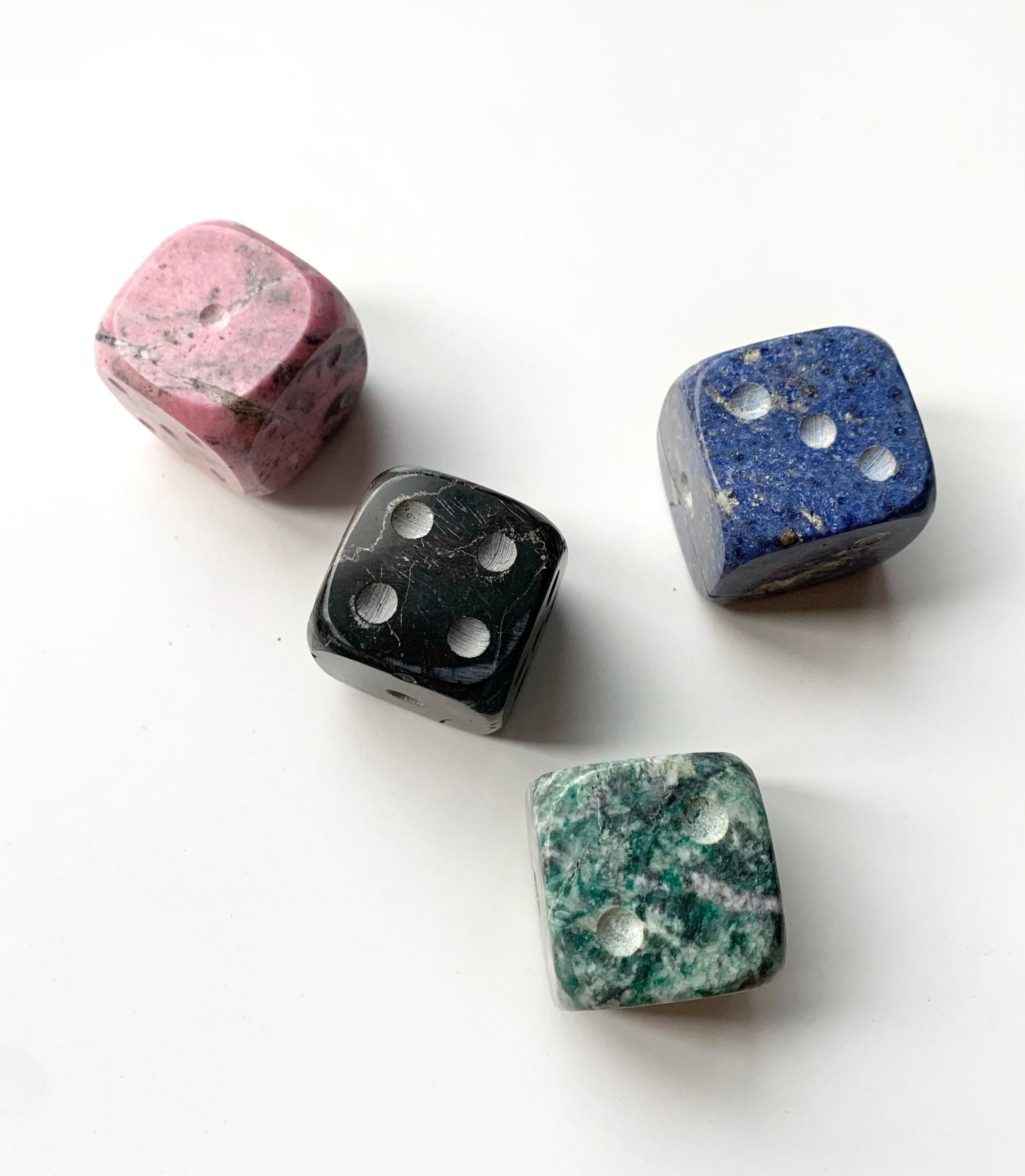 Roll in style with gemstone Dice, made from genuine semi-precious stones. A playful addition to game night or a unique gift for puzzle and board game enthusiasts.

Bring the magic home with this set of 4 oversized gemstone dice by DAR Proyectos.