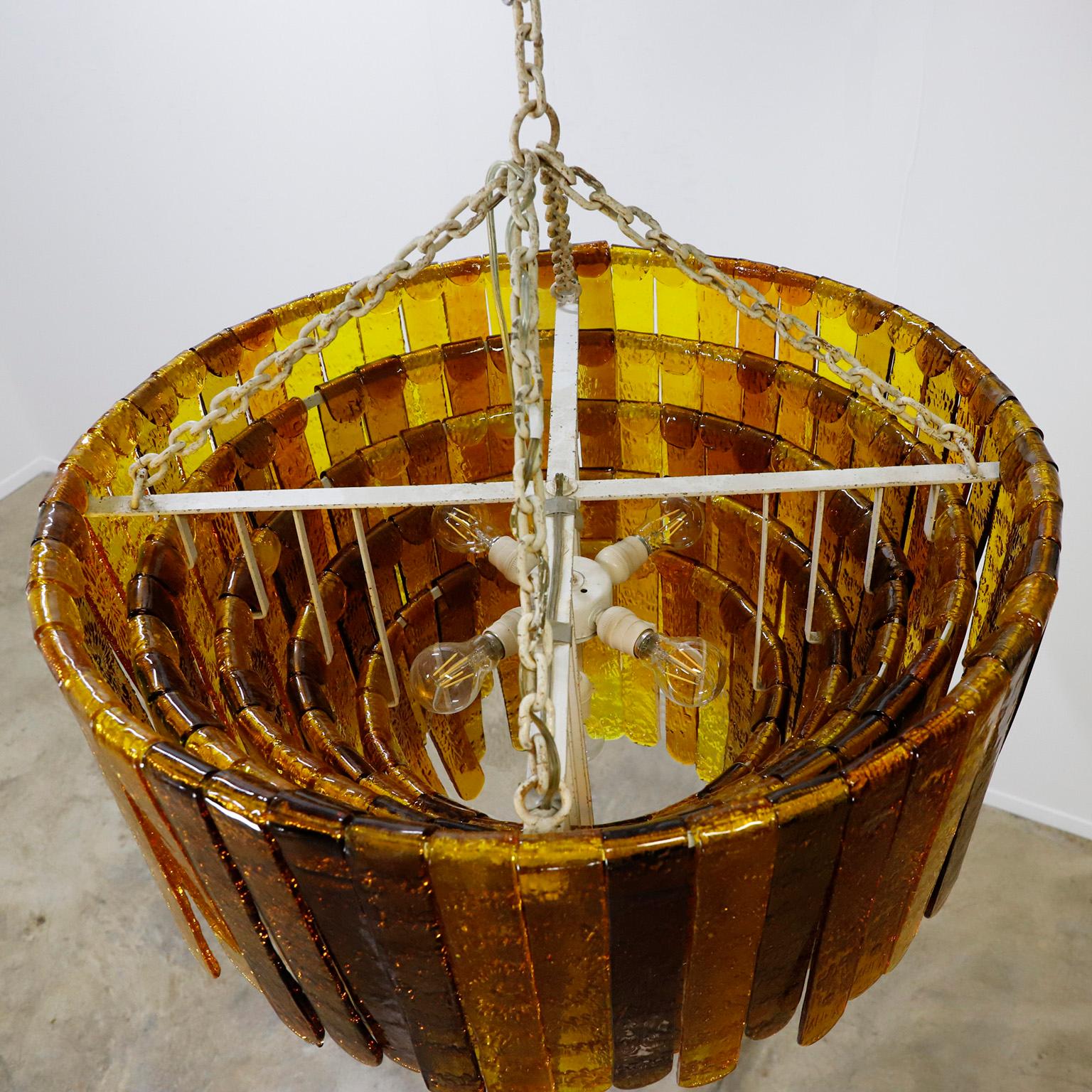 If you are looking for a huge dimensions chandelier.  We offer this unique piece made entirely by hand, designed by Felipe Delfinger for a residence in Mexico around 1970.
This masterful work  was made with 186 handmade glass blocks 34 cm long by 5