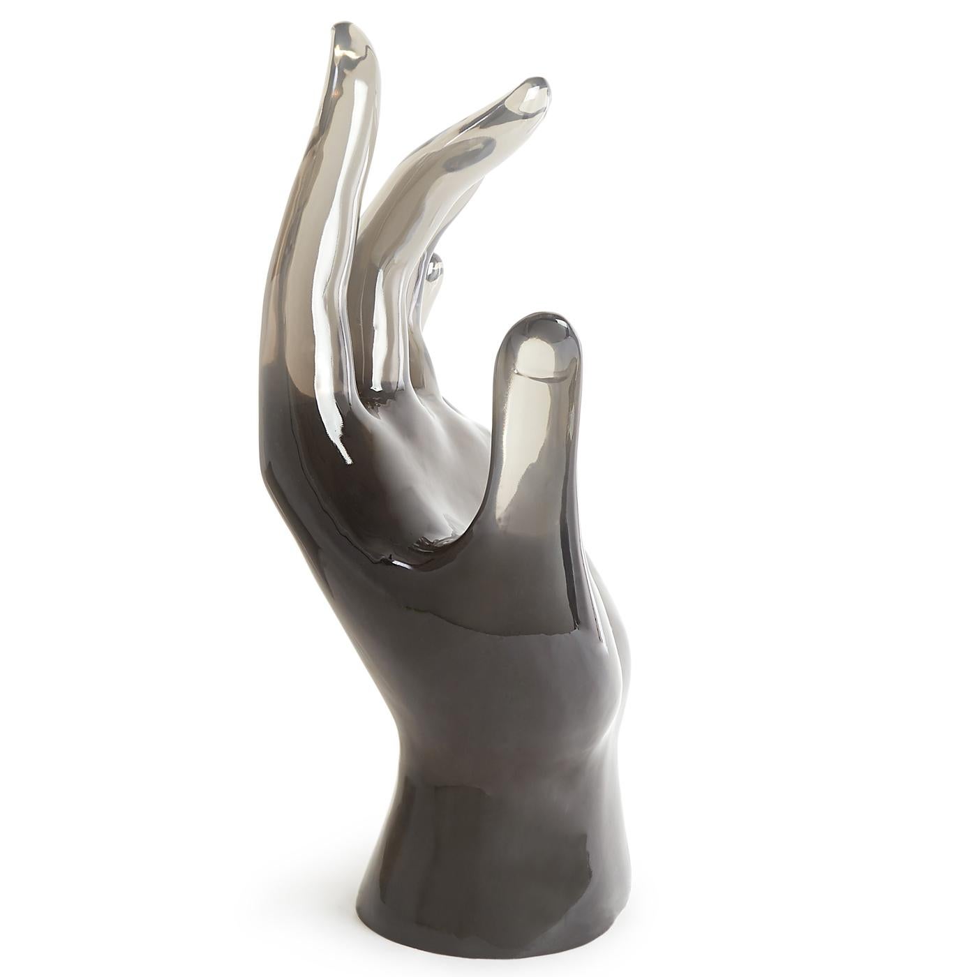 Surreal size. Surprising style beckoning? Let us give you a hand—our giant Lucite hand anchors any tablescape or makes a great focal point in an unused fireplace.

Our oversized acrylic sculptures start their journey in our Soho pottery studio,