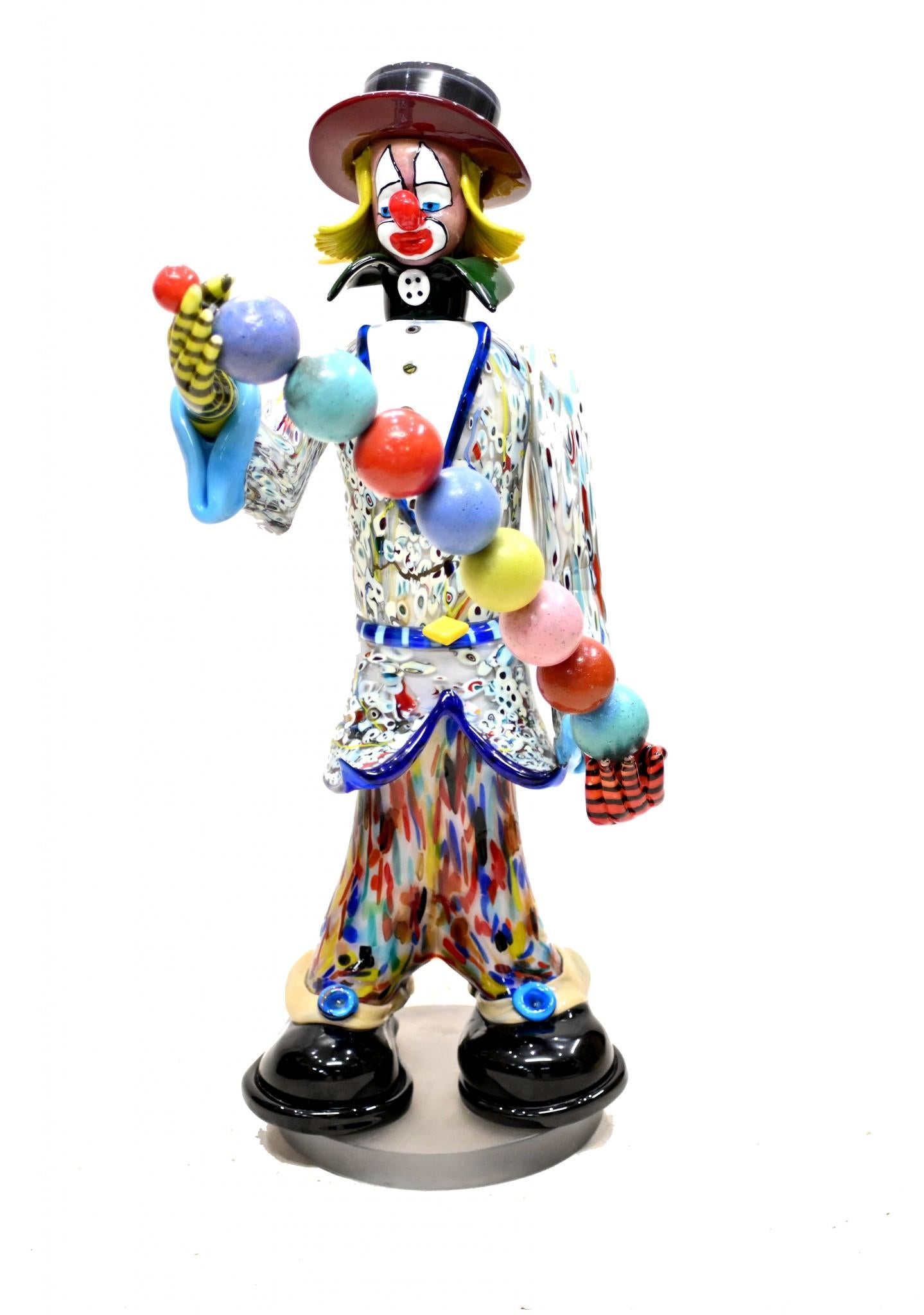 You are viewing a unique Italian Murano glass clown Standing at almost four feet tall - 109 CM - this really is a big piece Such a characterful piece with vivid colours and the juggling balls The effects - smearing, smudging - of the glass