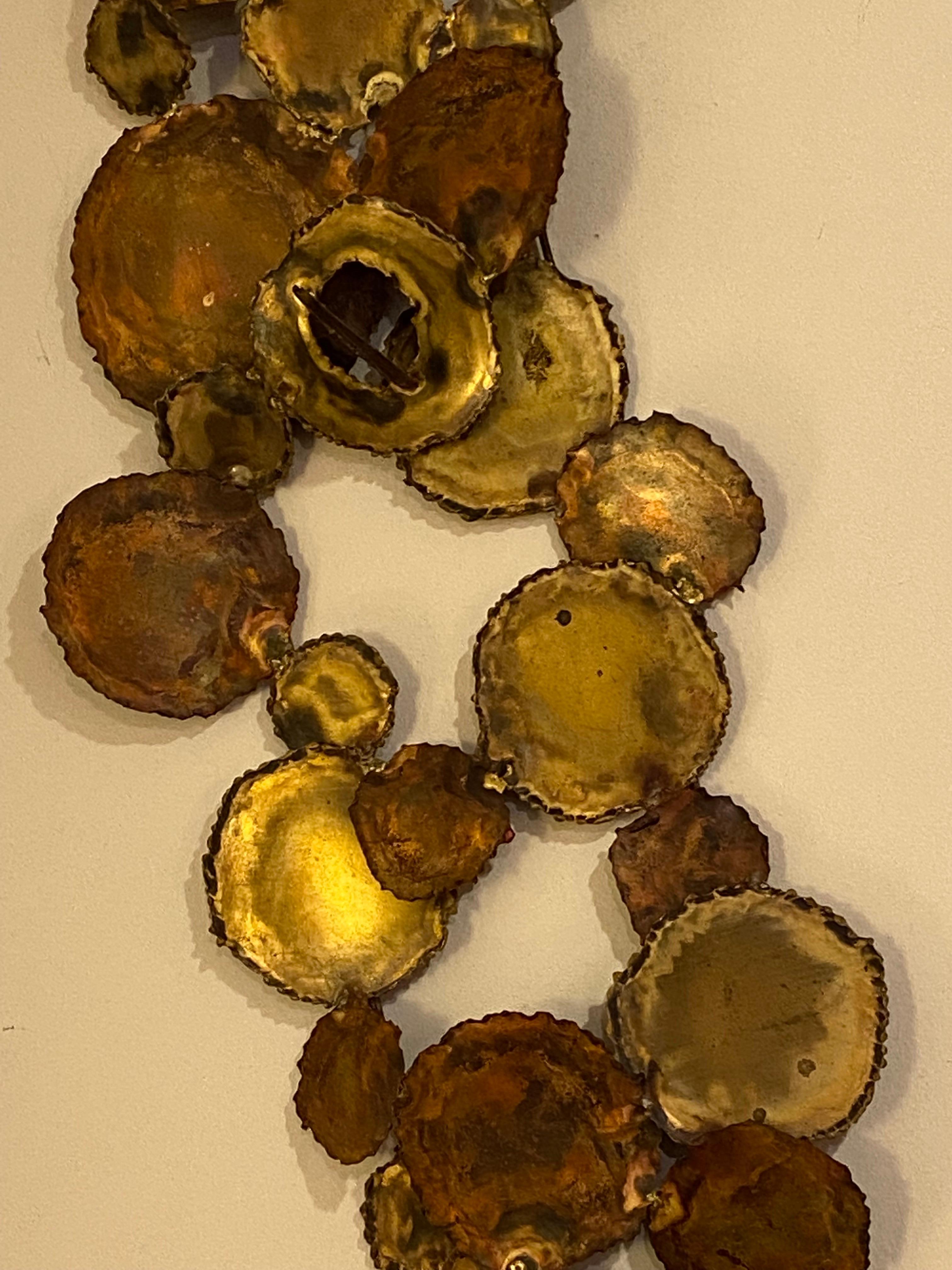 Large Scale C. Jere wall sculpture. Metal with brass and copper details and spot welds around edges of circular discs. Can easily be hung Horizontally or Vertically! One of the biggest ones I have owned!