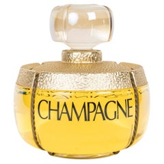 Giant, Large Champage perfume Bottle, Yves Saint Laurent, XXth Century.