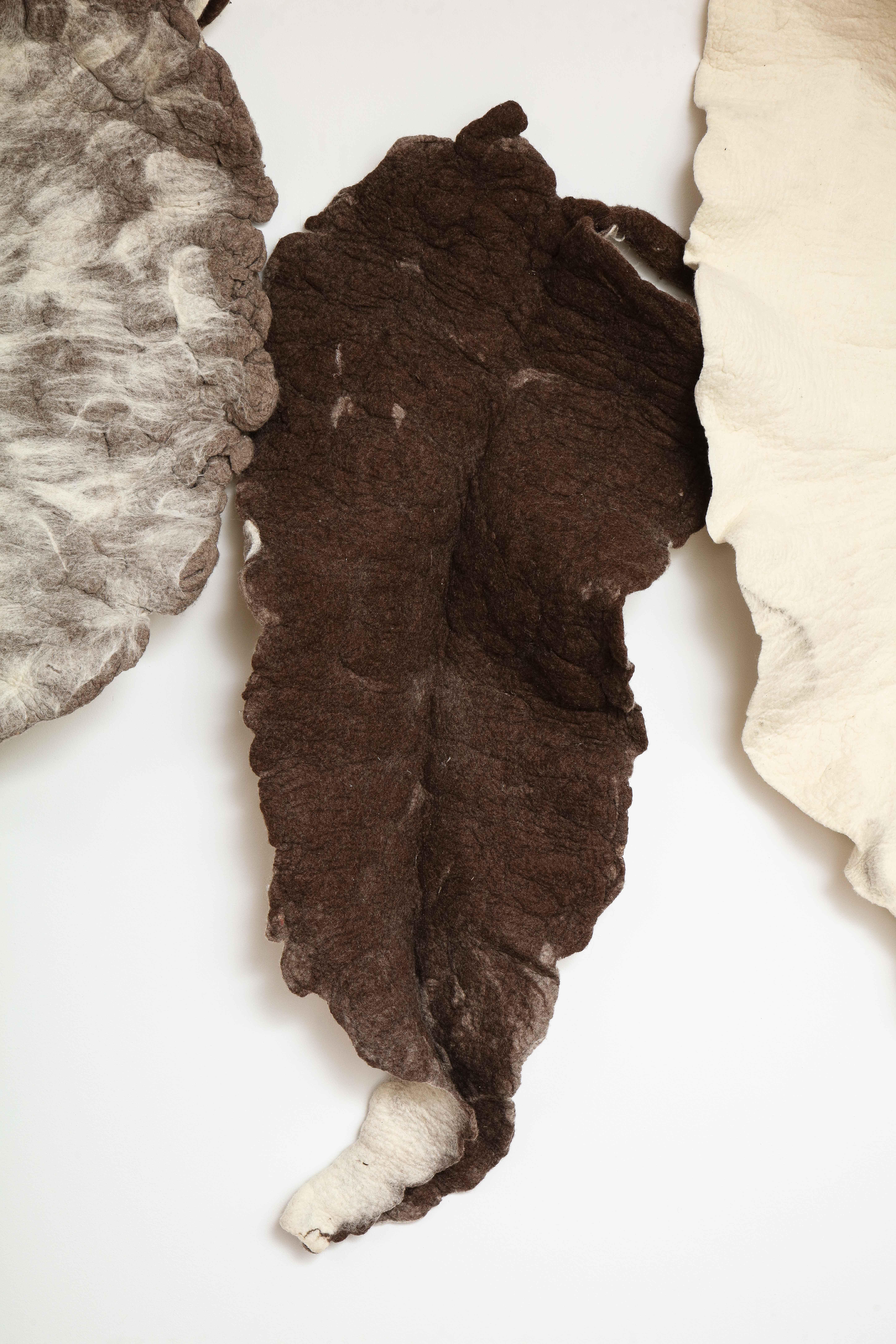 Giant Leaf, Naturally Dyed Felted Wool Sculpture by Inês Schertel, Brazil

Ines Schertel's primary material is sheep's wool. As a practitioner of Slow Design, the artist takes a holistic approach to textile design, personally overseeing the whole
