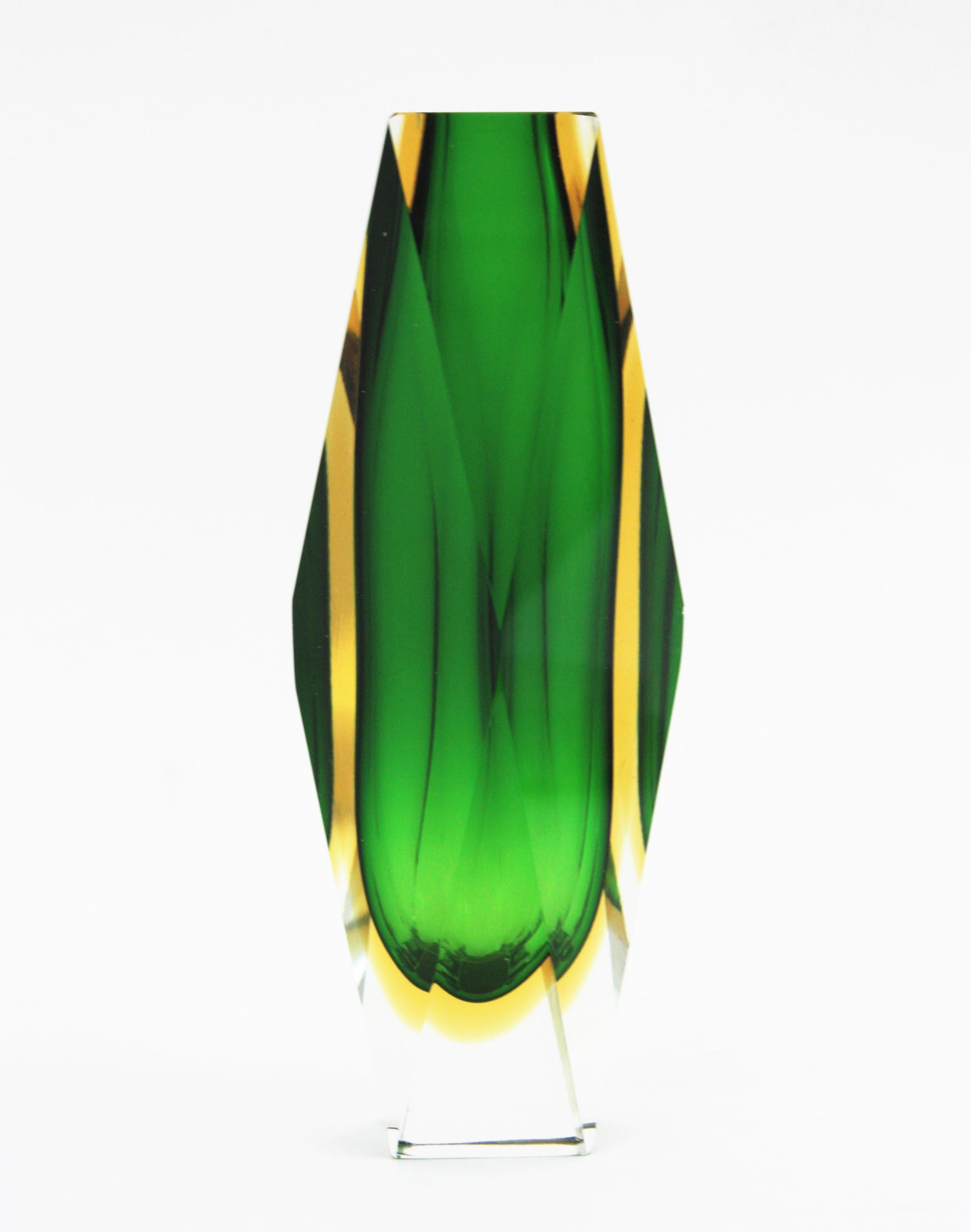 Massive Sommerso vase with faceted glass in Green and yellow glass cased into clear glass. Attributed to Mandruzzato, Italy, 1960s.
Green glass with a layer of yellow glass cased into clear glass using the Sommerso technique.
Gorgeous placed as a