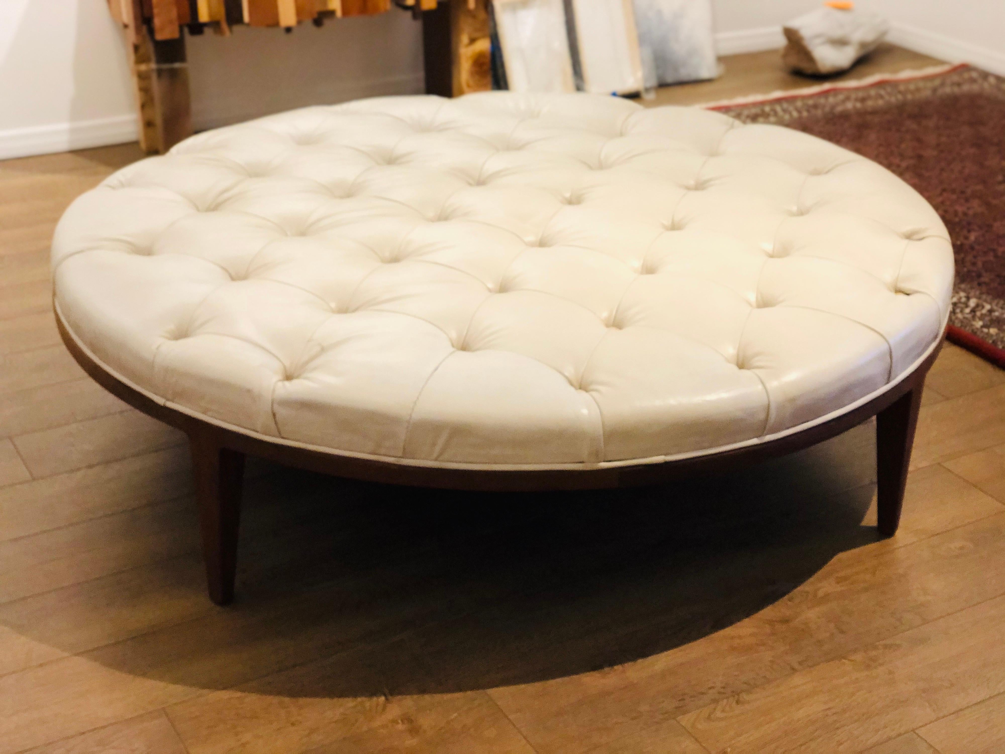 Beautiful very rare giant ottoman/coffee table in tufted leather and solid walnut base, we have refinished the base looks great the top leather shows some wear due to age overall it's ok. We belive it's manufactured by Drexel.