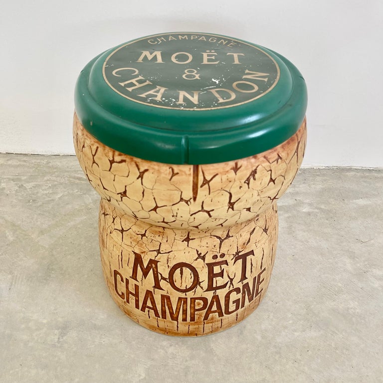Whimsical champagne bucket/cooler by Think Big. Made in New York City, 1987. Stamped on underside. In the shape of champagne cork by Moet & Chandon. Made of heavy duty plastic and rubber. Inside of cooler has plastic bucket to hold water/ice. Great