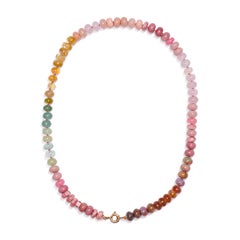 Collana in oro giallo con zaffiro rosa gigante e diamante opale