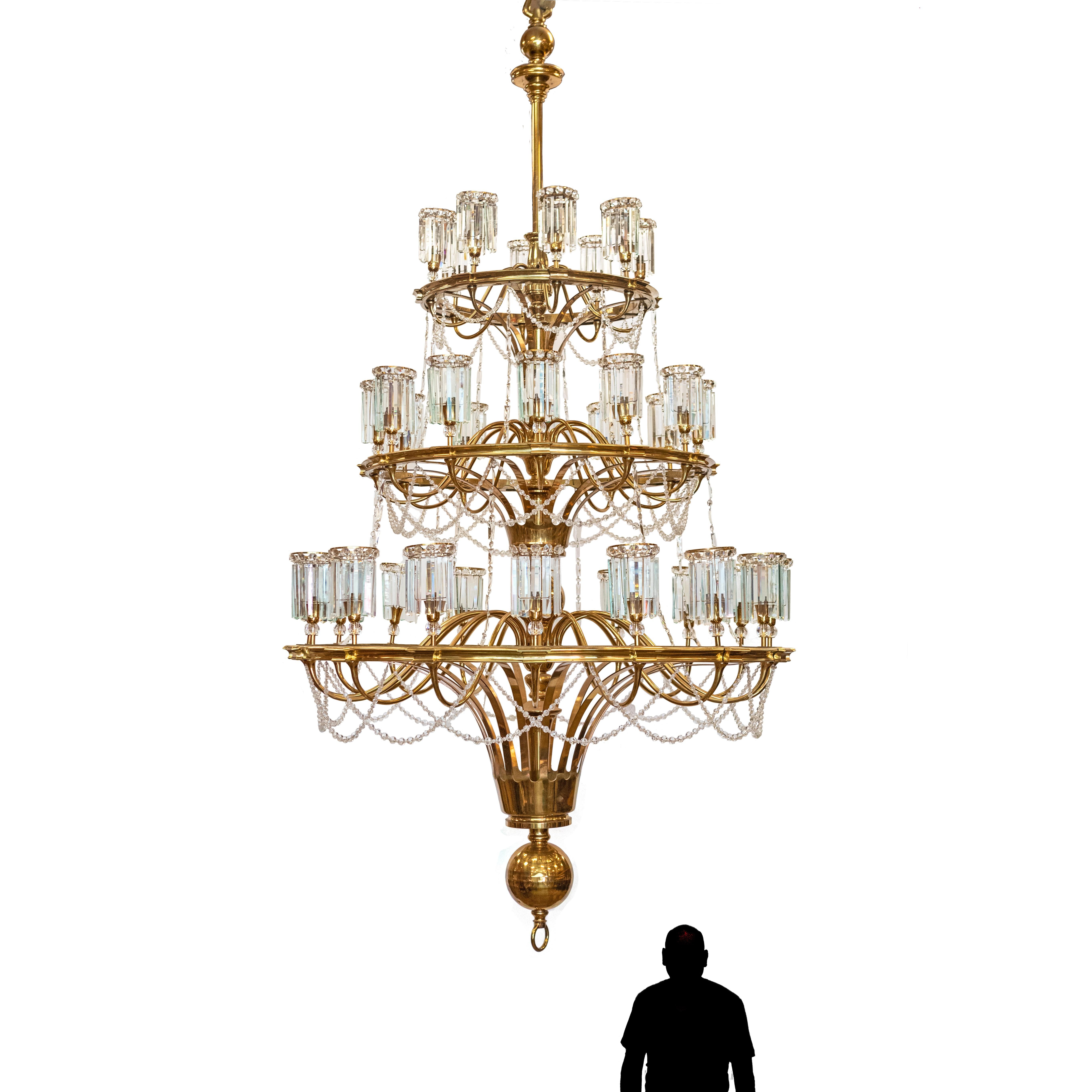 The sheer size and scale of this chandelier are spectacular.

Once belonging to the Leathersellers, London, a Livery board and charitable foundation with a first Royal Charter in 1444 - The crystal and brass chandelier took prime position on the